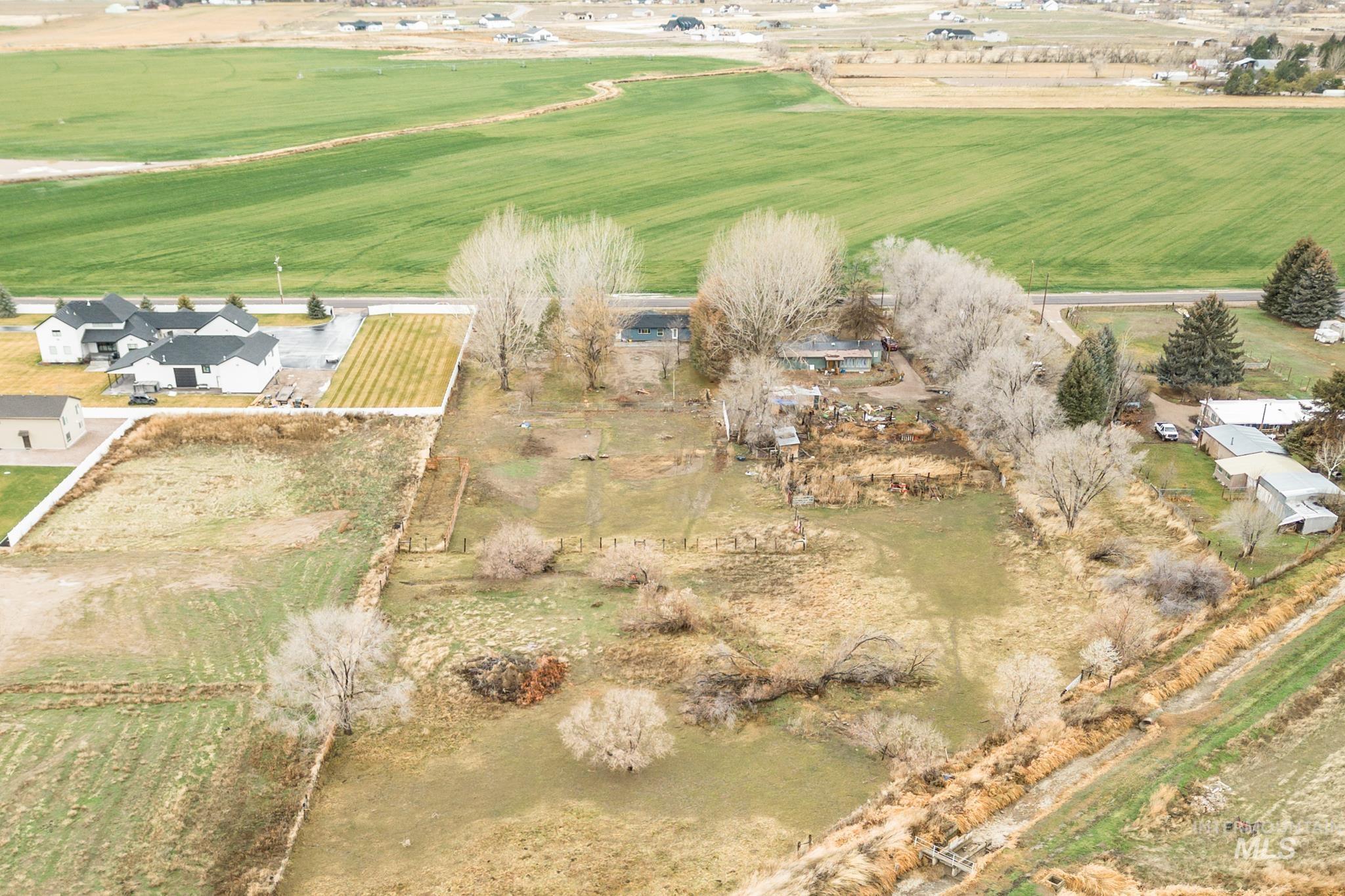 Aerial view of property and surrounding area with rural landscape