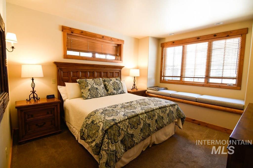 Carpeted bedroom with baseboards