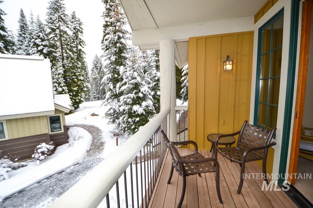 View of snow covered back of property