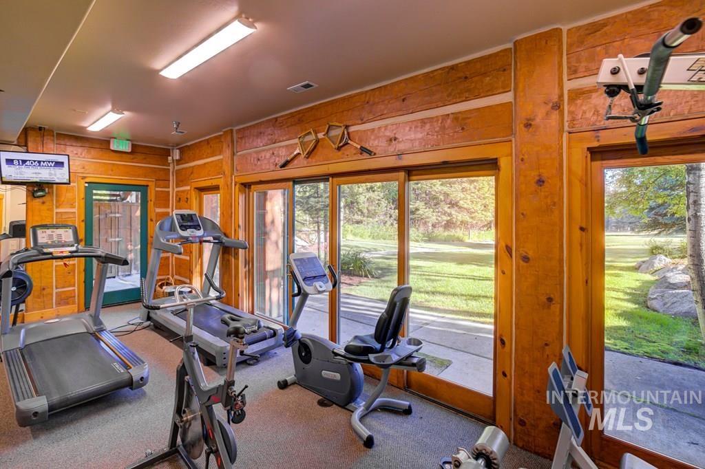 Workout area with wood walls
