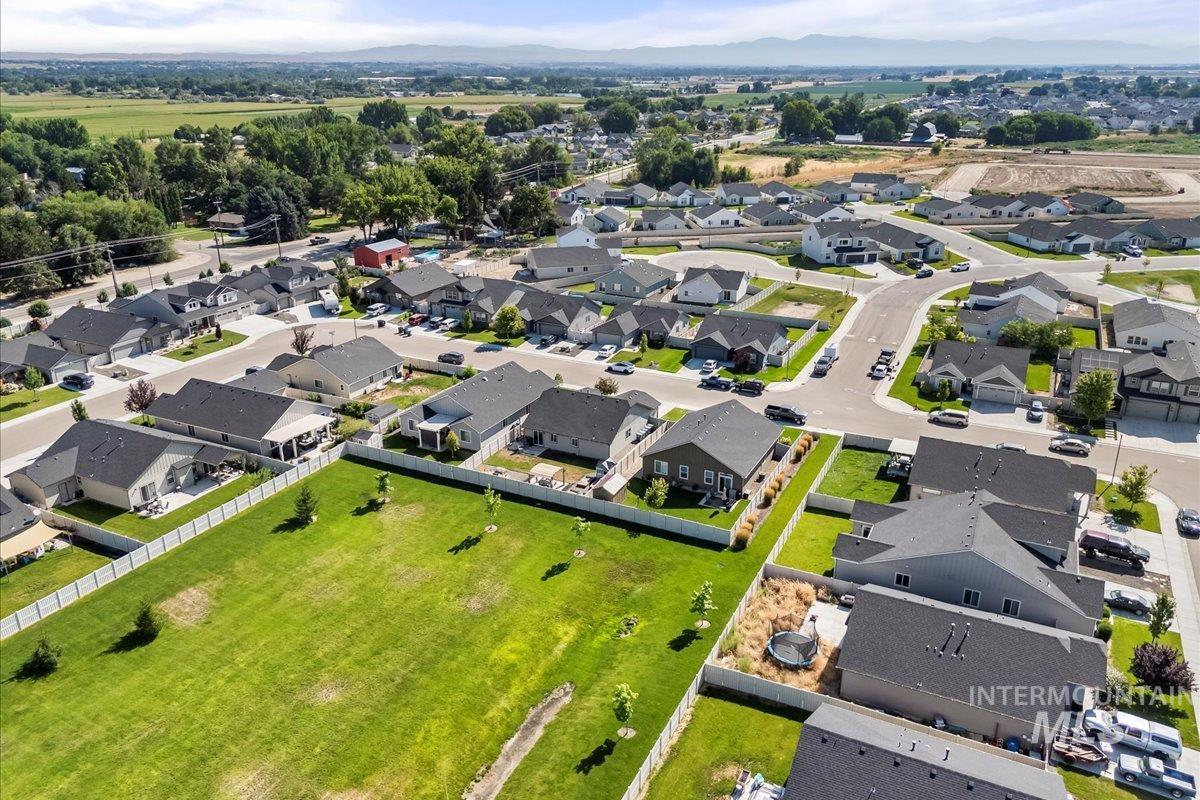 Aerial overview of property's location featuring nearby suburban area