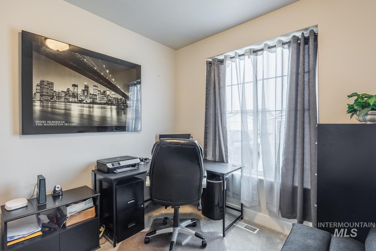 Home office with light carpet