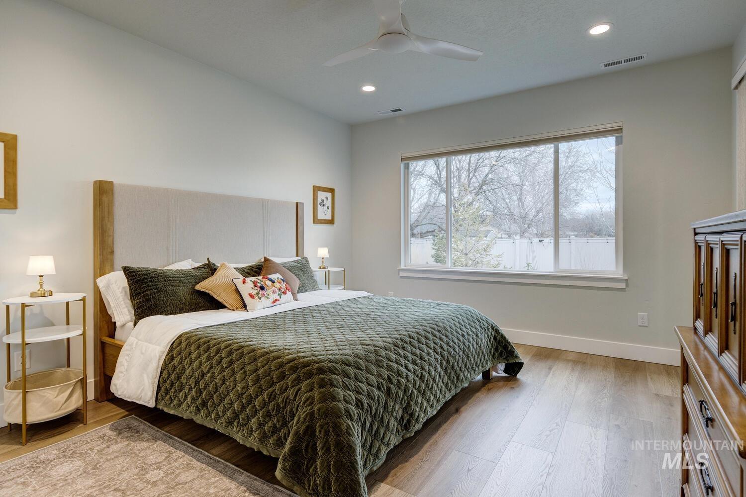 Bedroom featuring light wood-type flooring, recessed lighting, and ceiling fan
