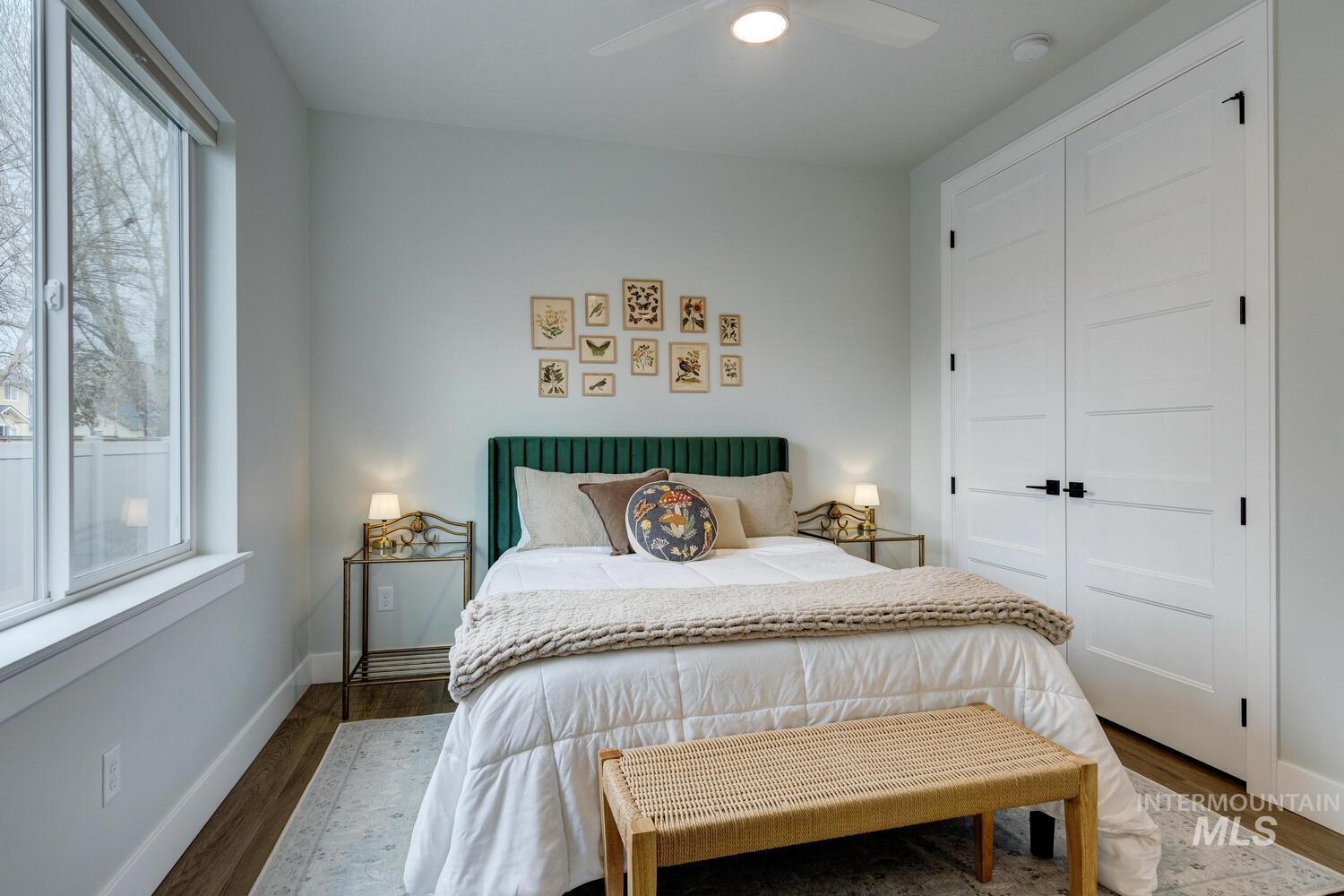 Bedroom featuring a closet, ceiling fan, and wood finished floors