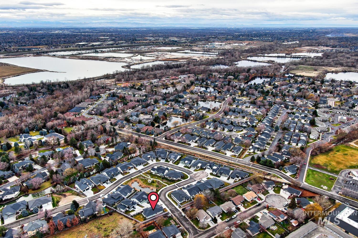 View of property location with nearby suburban area