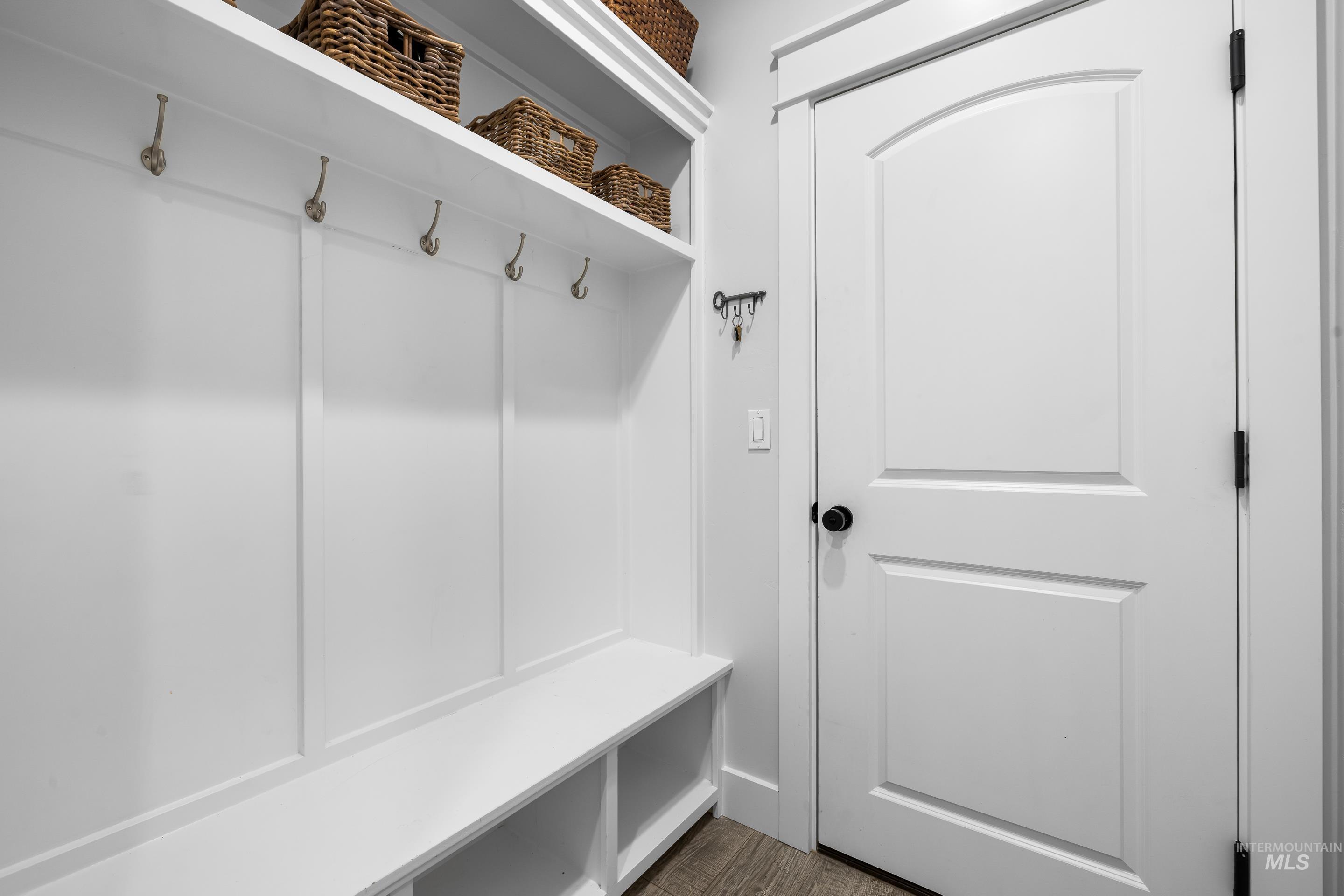 Mudroom with dark wood-type flooring