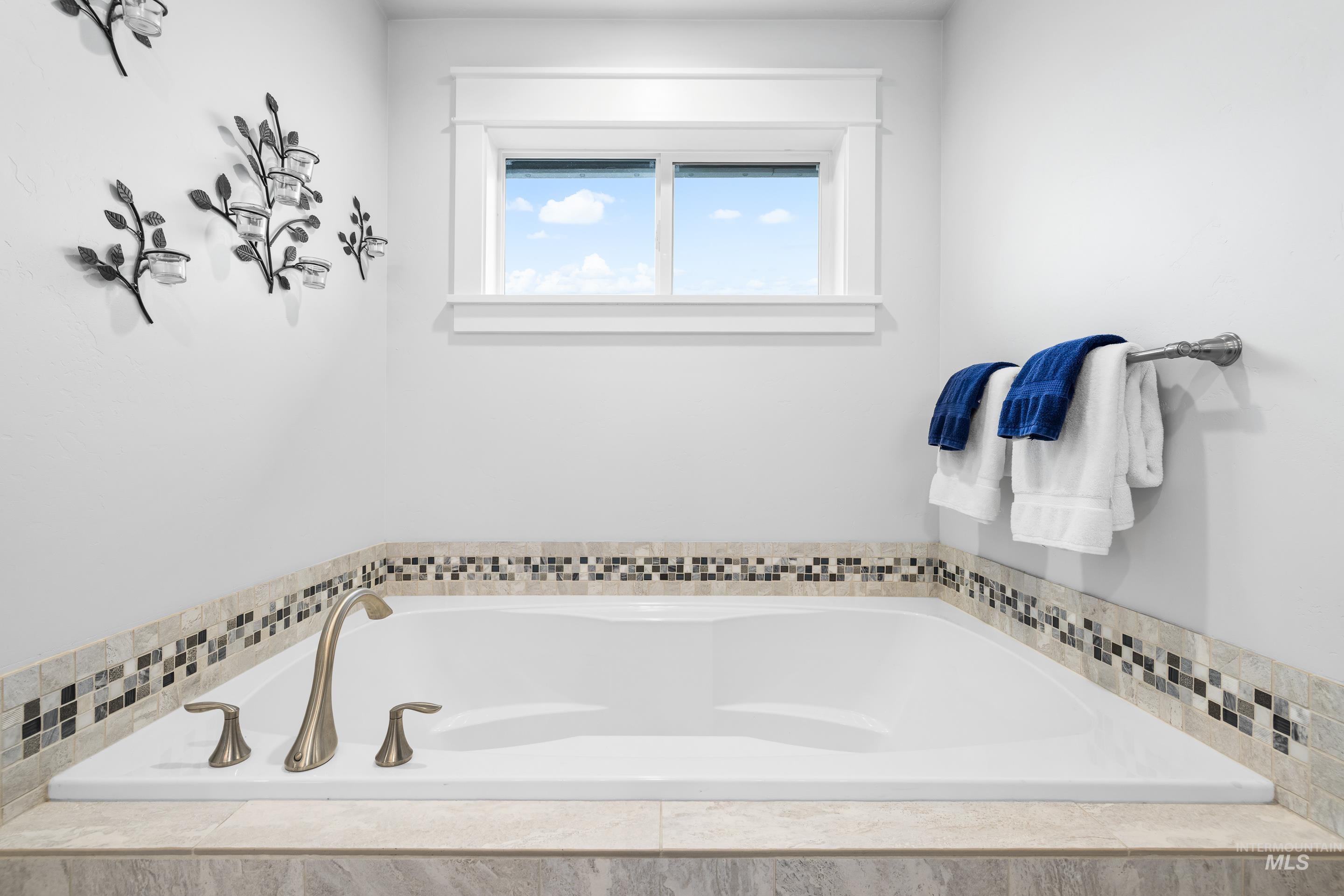 Full bath featuring a garden tub