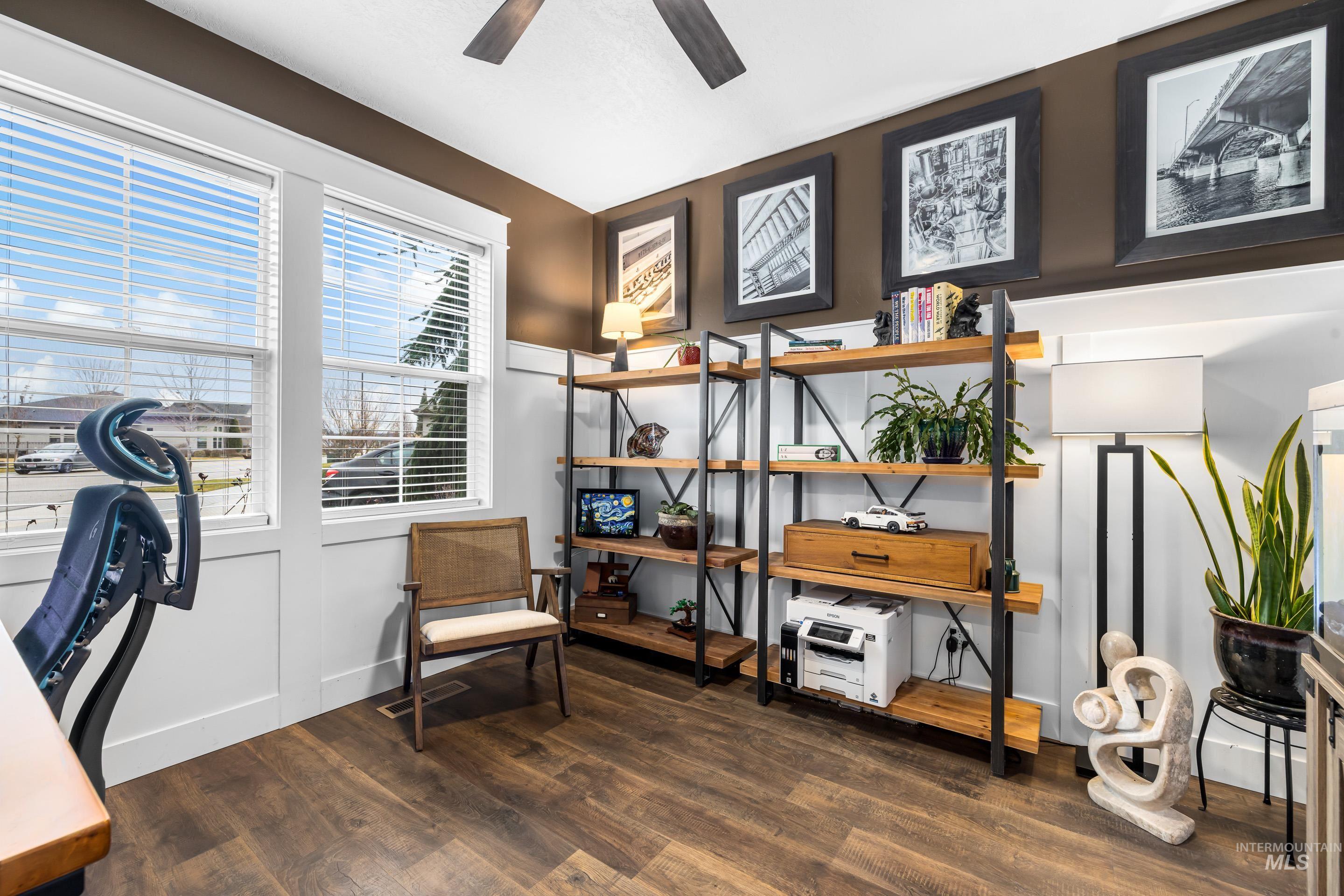 Office area with dark wood-style floors