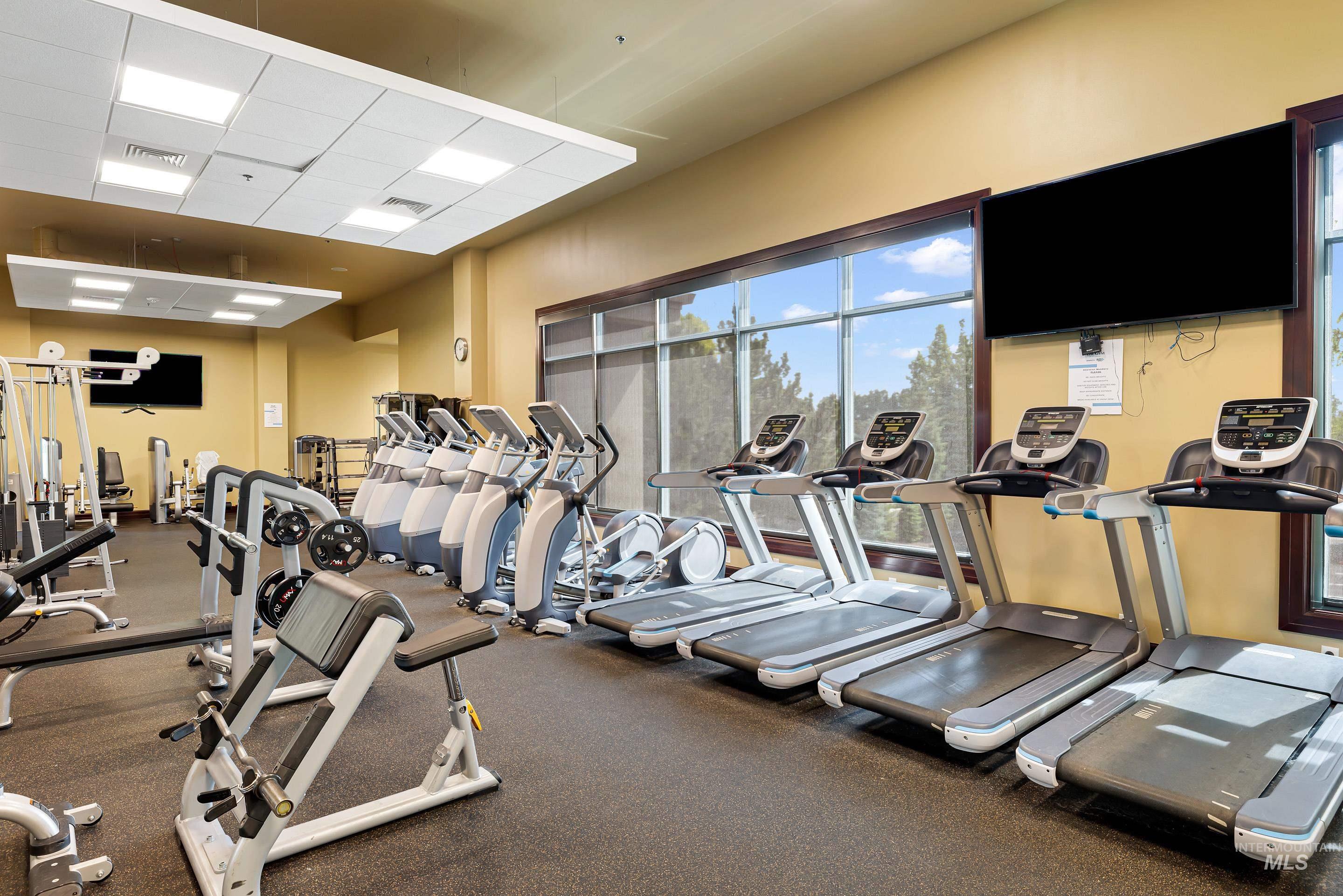 Gym featuring a paneled ceiling