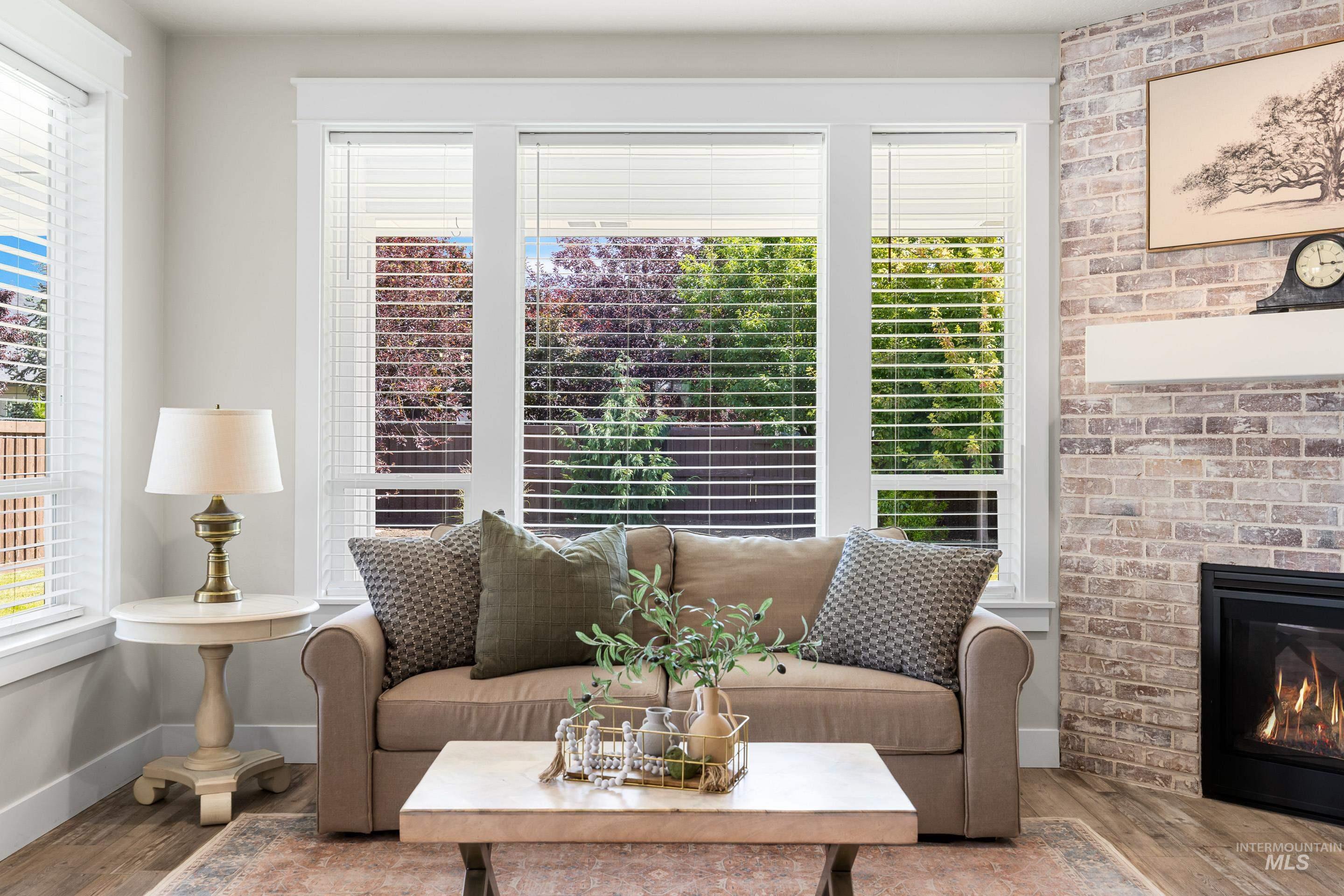 Living room with wood finished floors and a fireplace