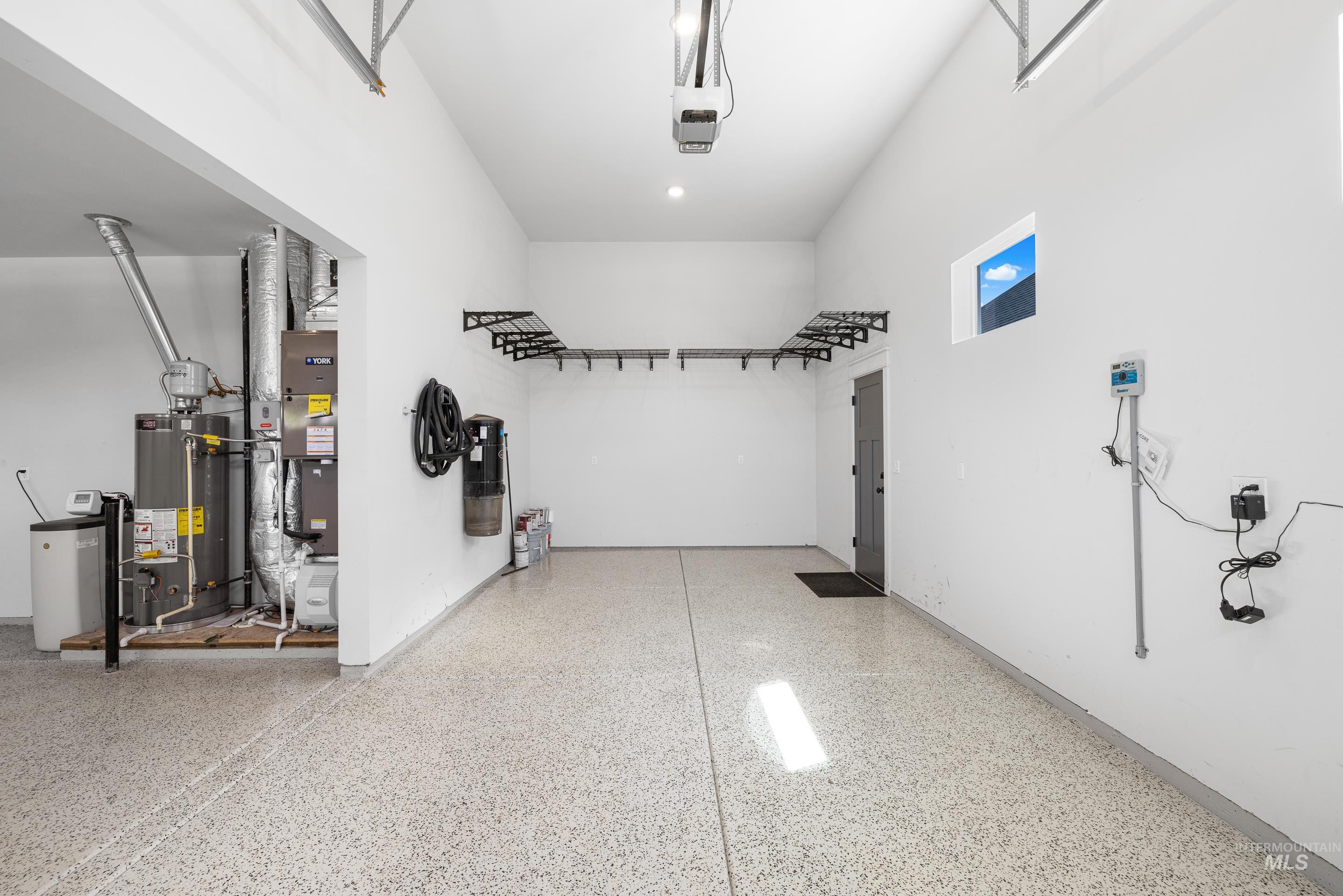 Garage with gas water heater and heating unit