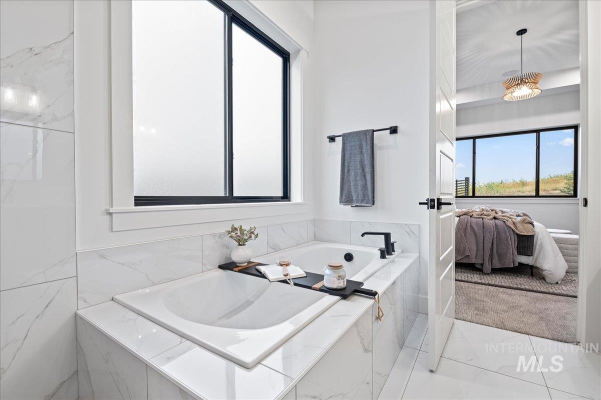 Ensuite bathroom with a bath