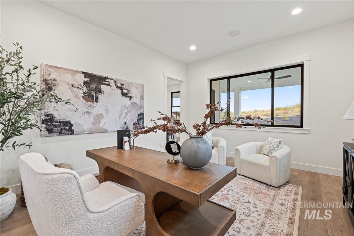 Dining space with light wood-type flooring and recessed lighting