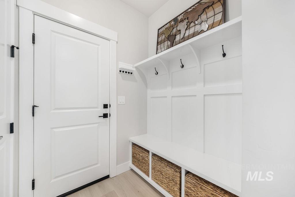 Mudroom featuring light wood-type flooring