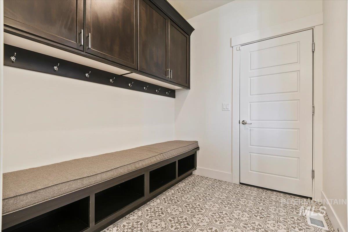 Mudroom featuring baseboards