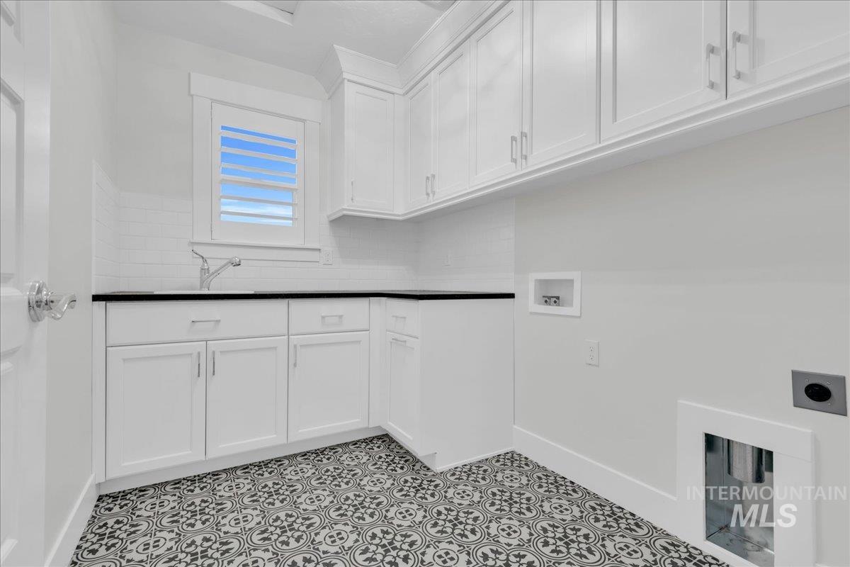 Washroom with hookup for a washing machine and cabinet space