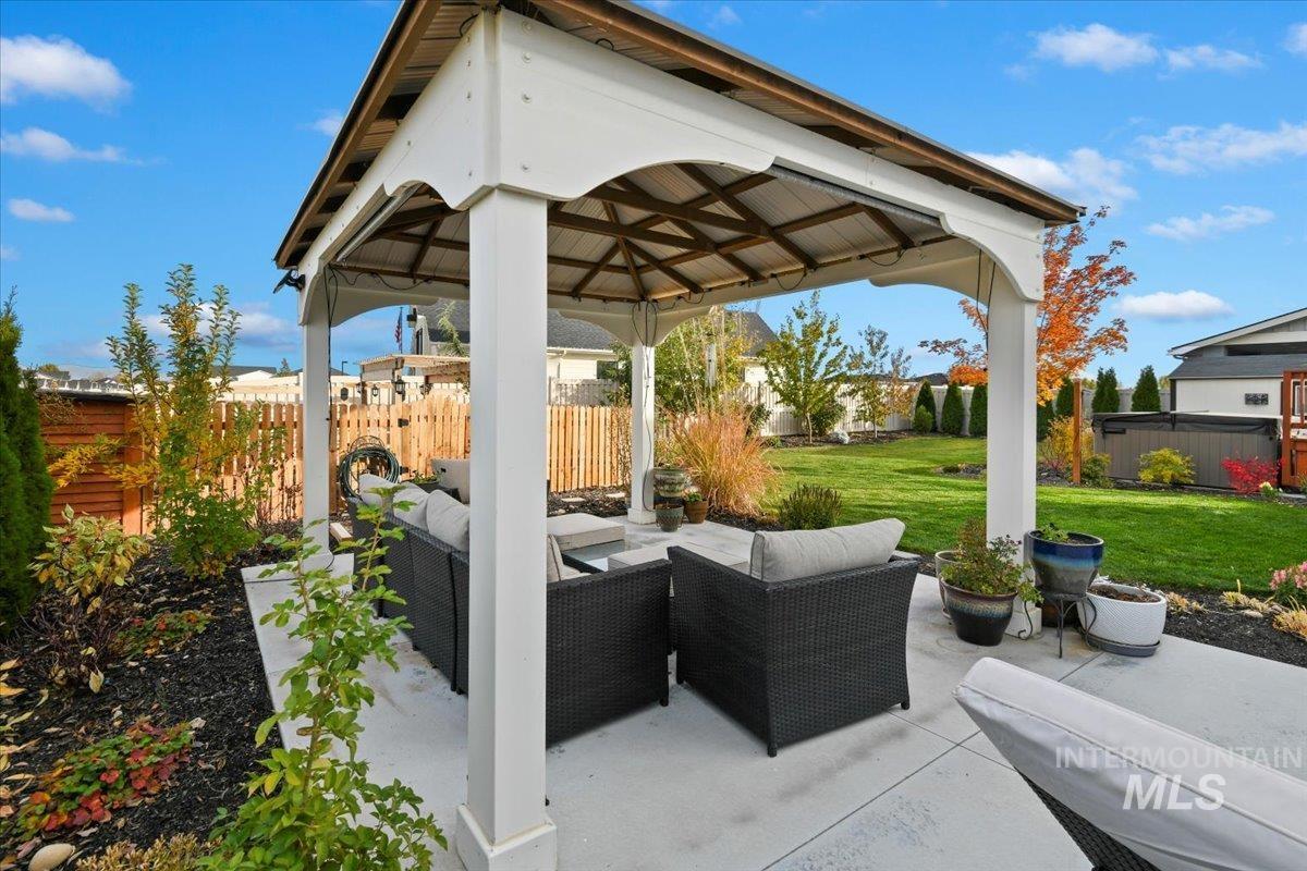 View of patio / terrace featuring an outdoor living space and a gazebo