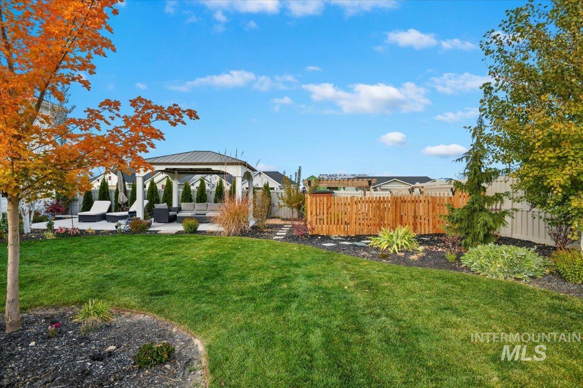 View of yard with a patio area, a gazebo, and outdoor lounge area