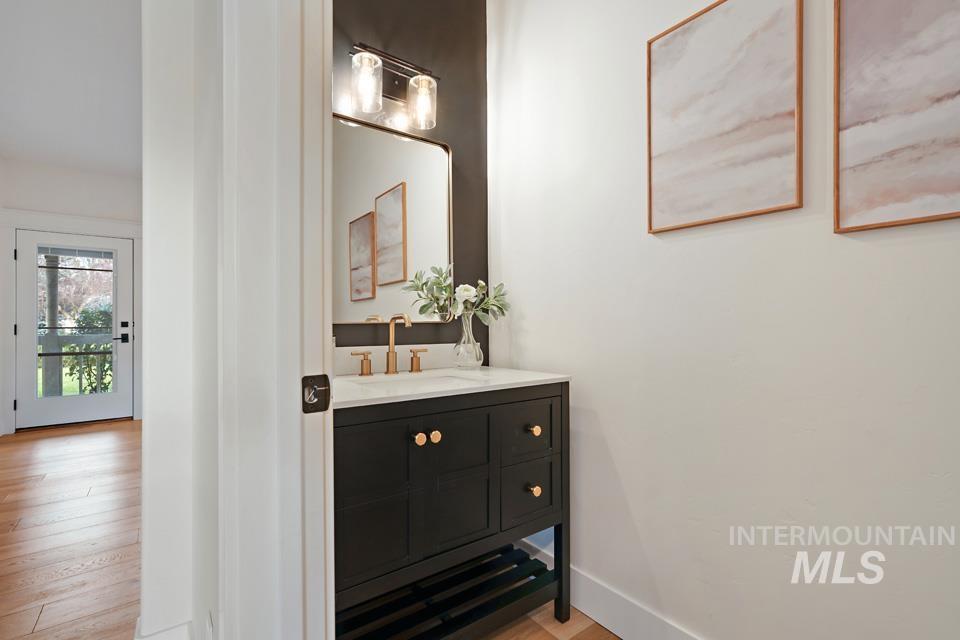 Bathroom with vanity and light wood-style flooring