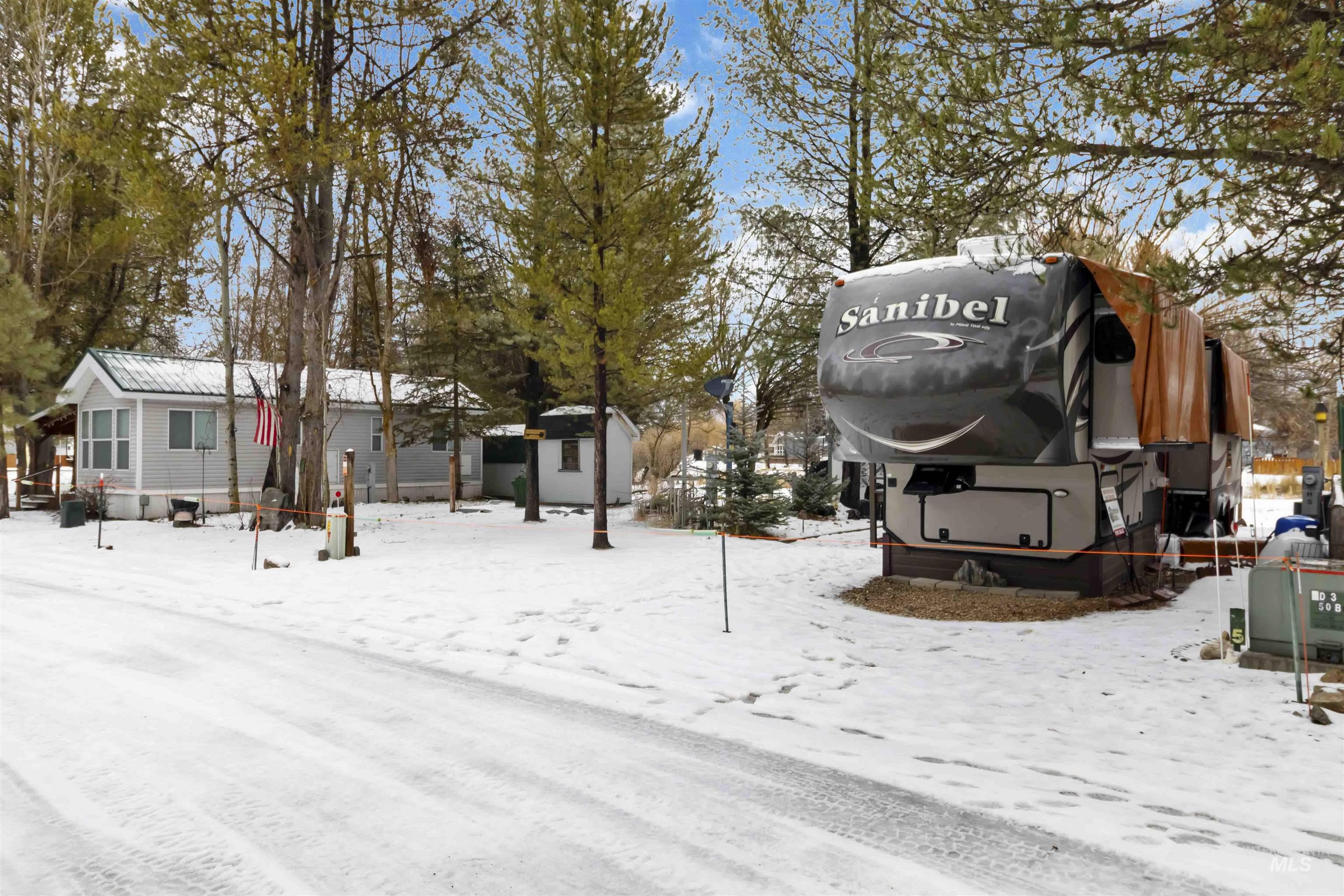 View of yard covered in snow