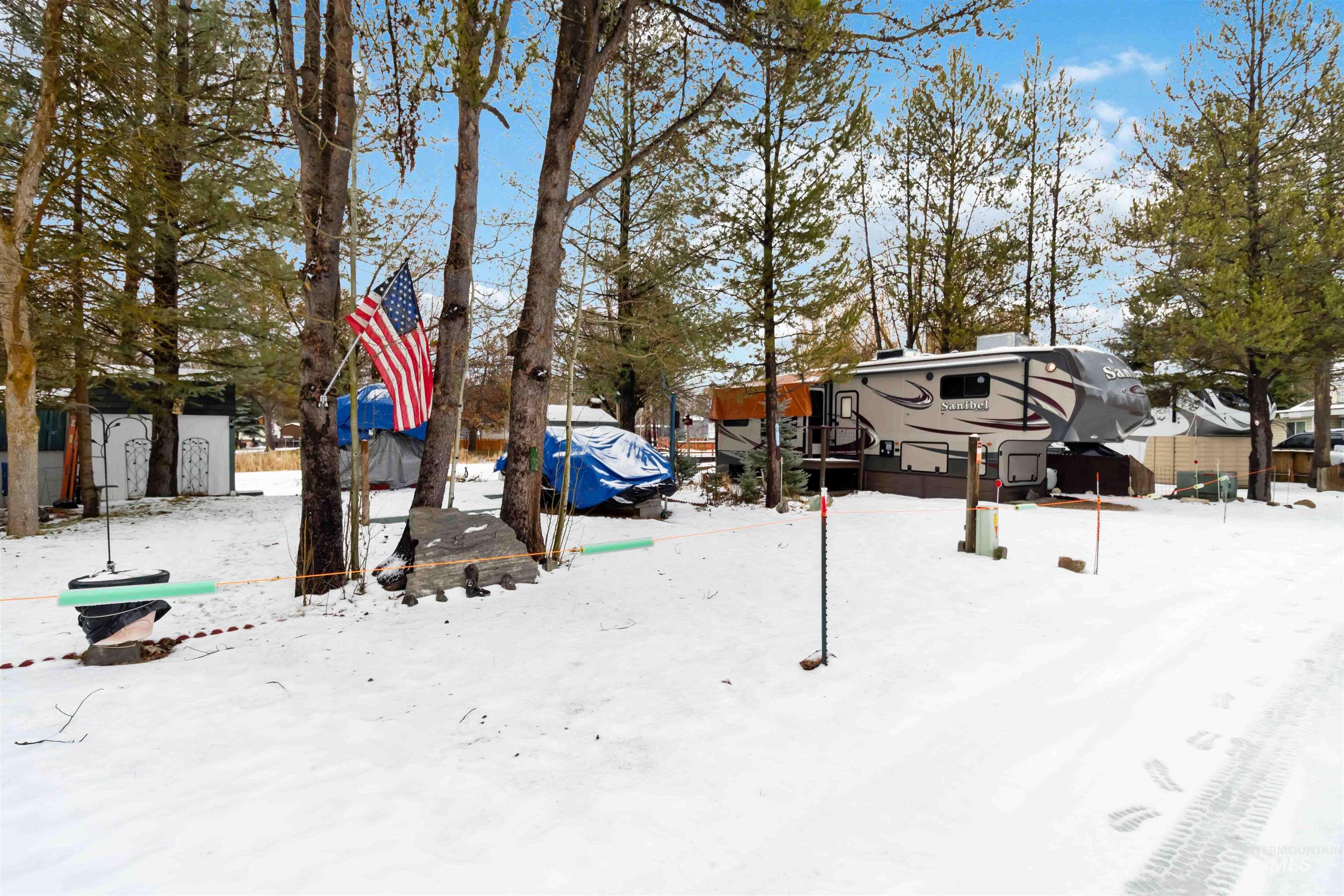 View of yard layered in snow