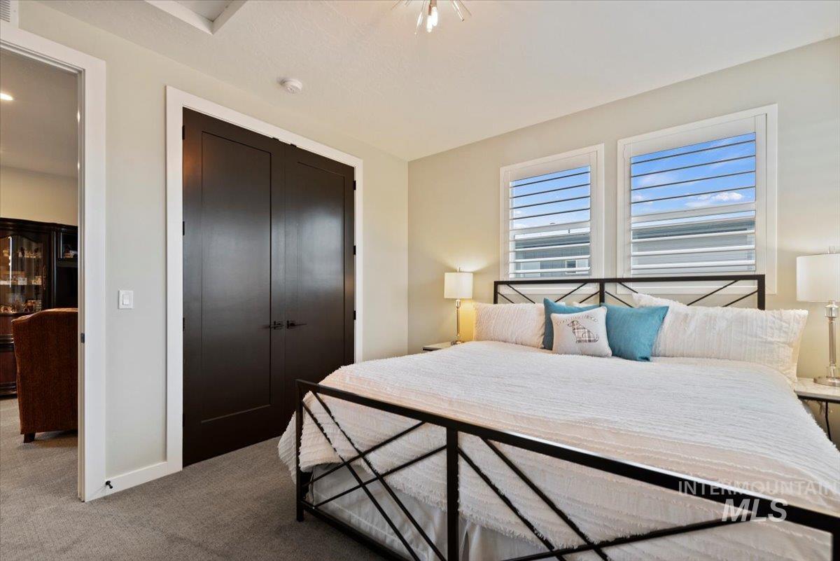 Bedroom with a closet and carpet floors
