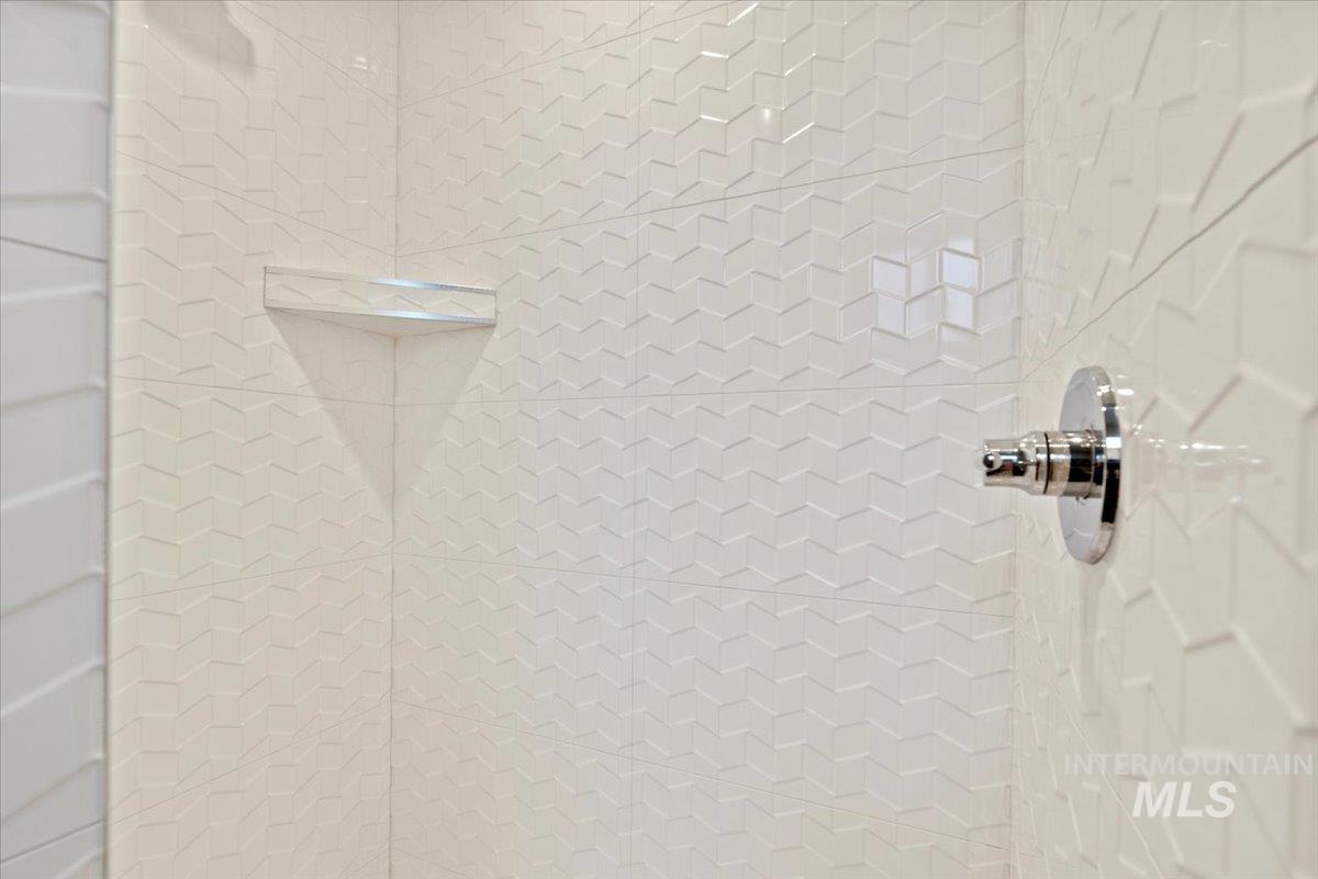 Bathroom view of a tile shower