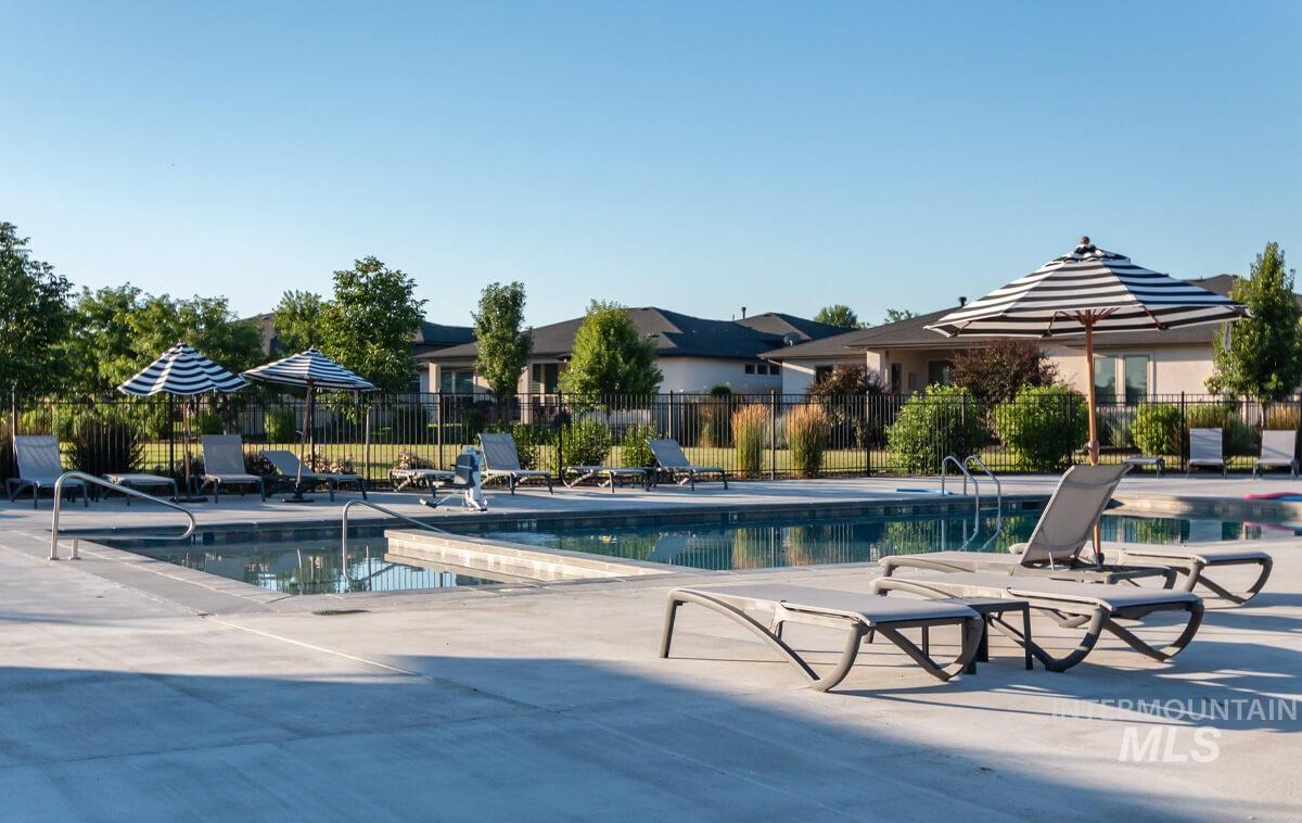Community pool with a patio