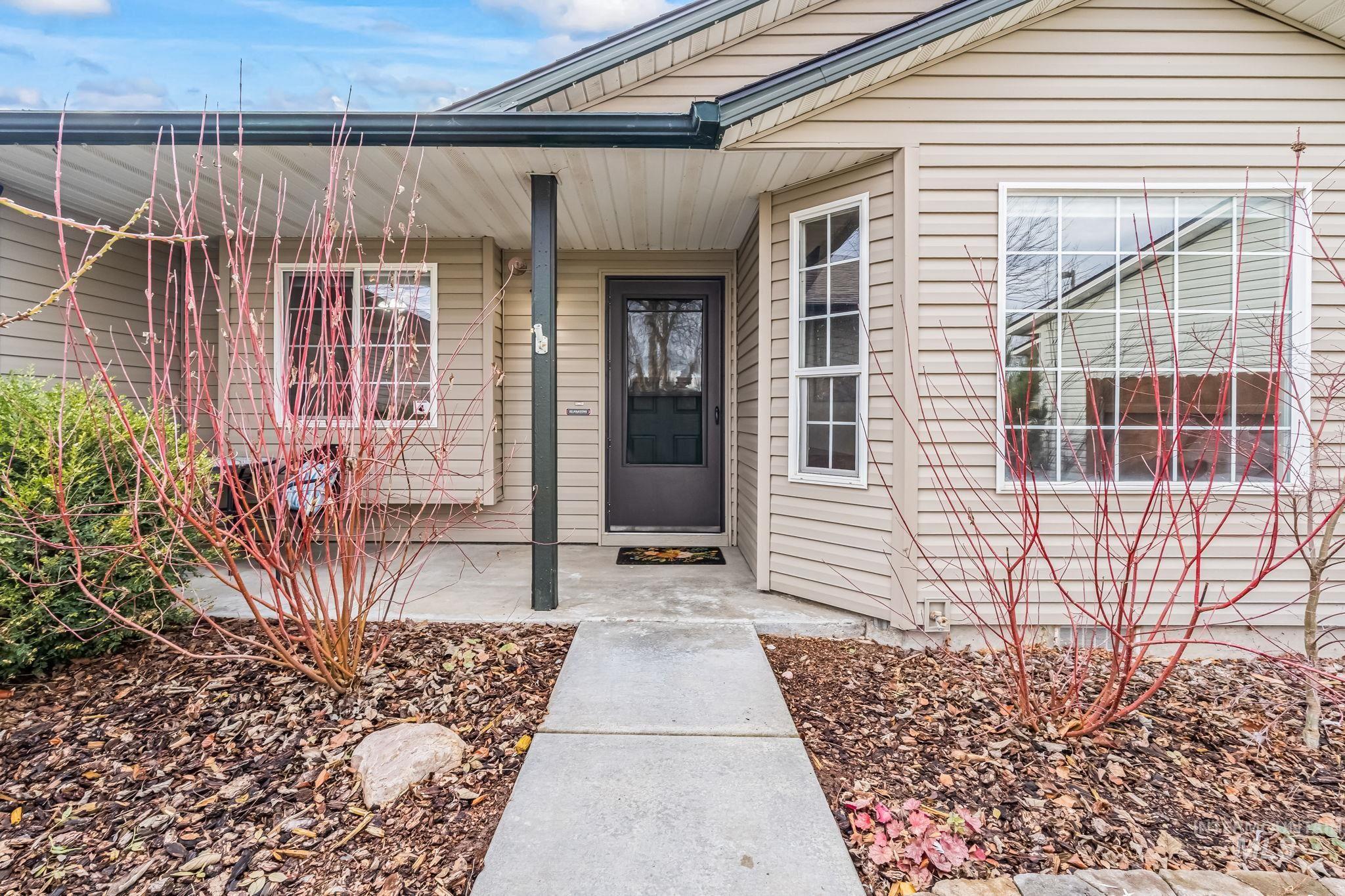 Entrance to property featuring a porch