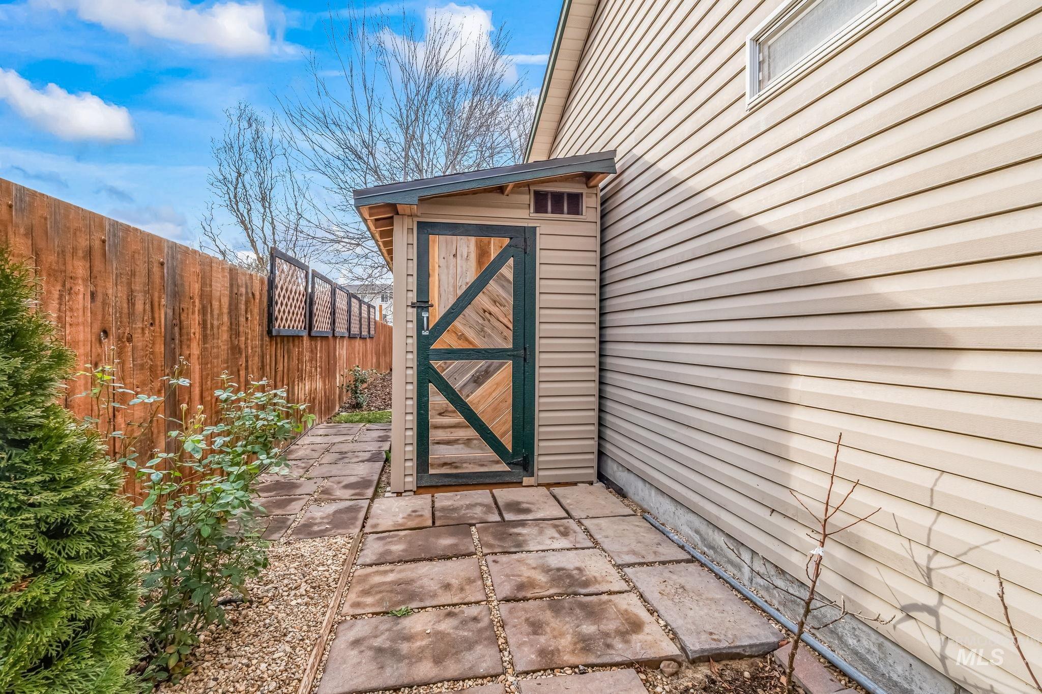 View of exterior entry featuring a patio area