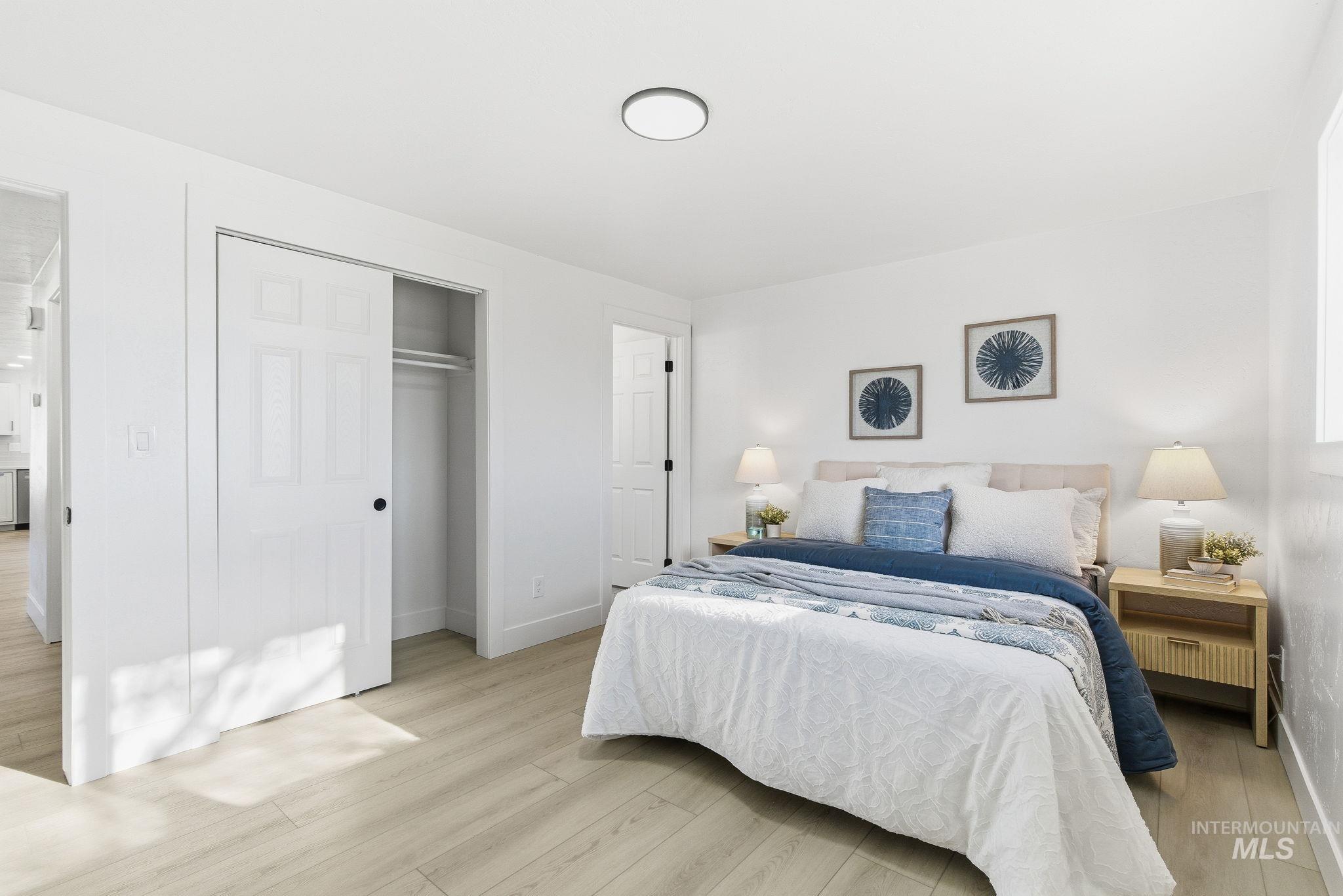 Bedroom featuring a closet and light wood finished floors