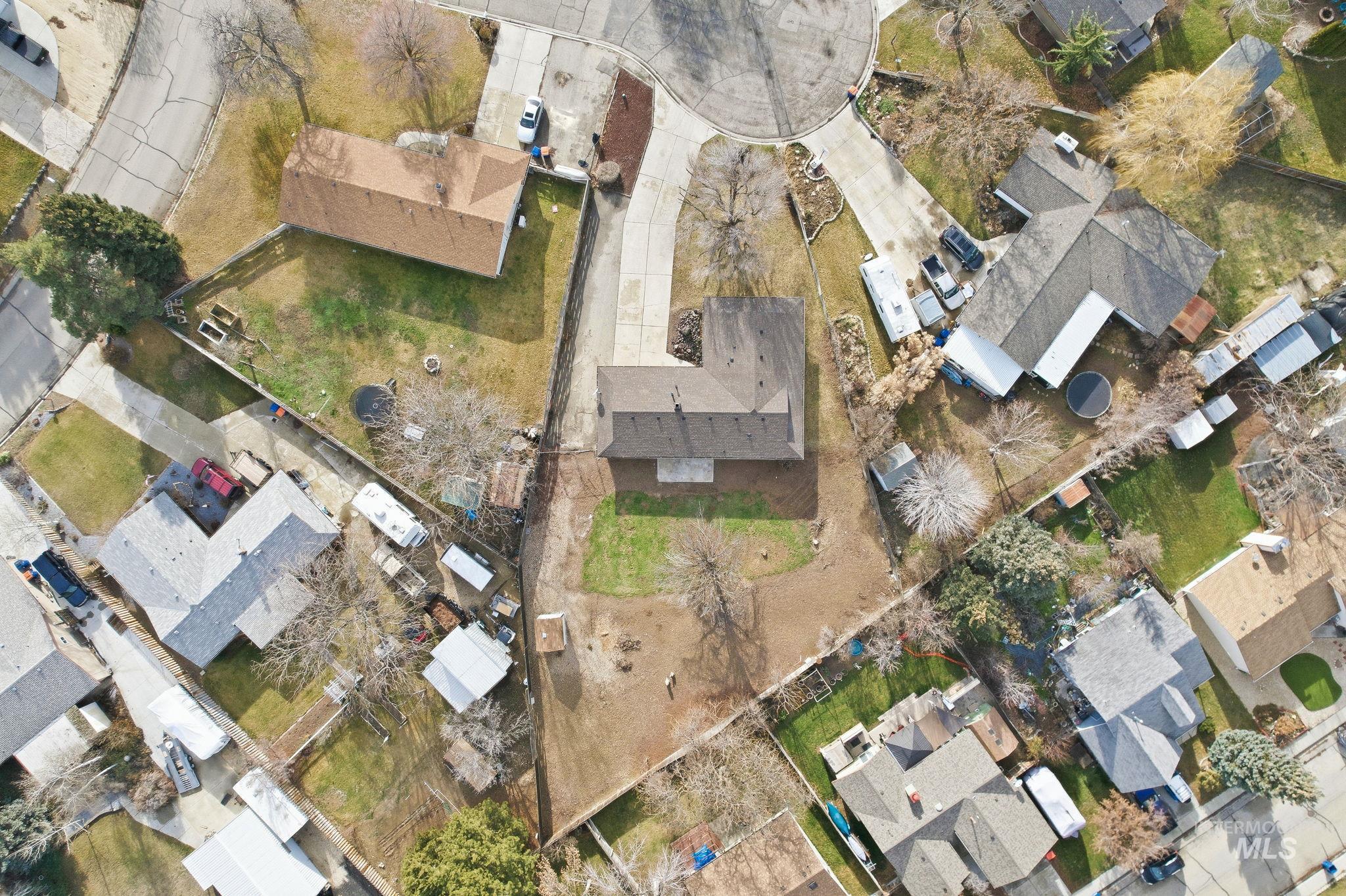 Aerial view of property's location featuring nearby suburban area