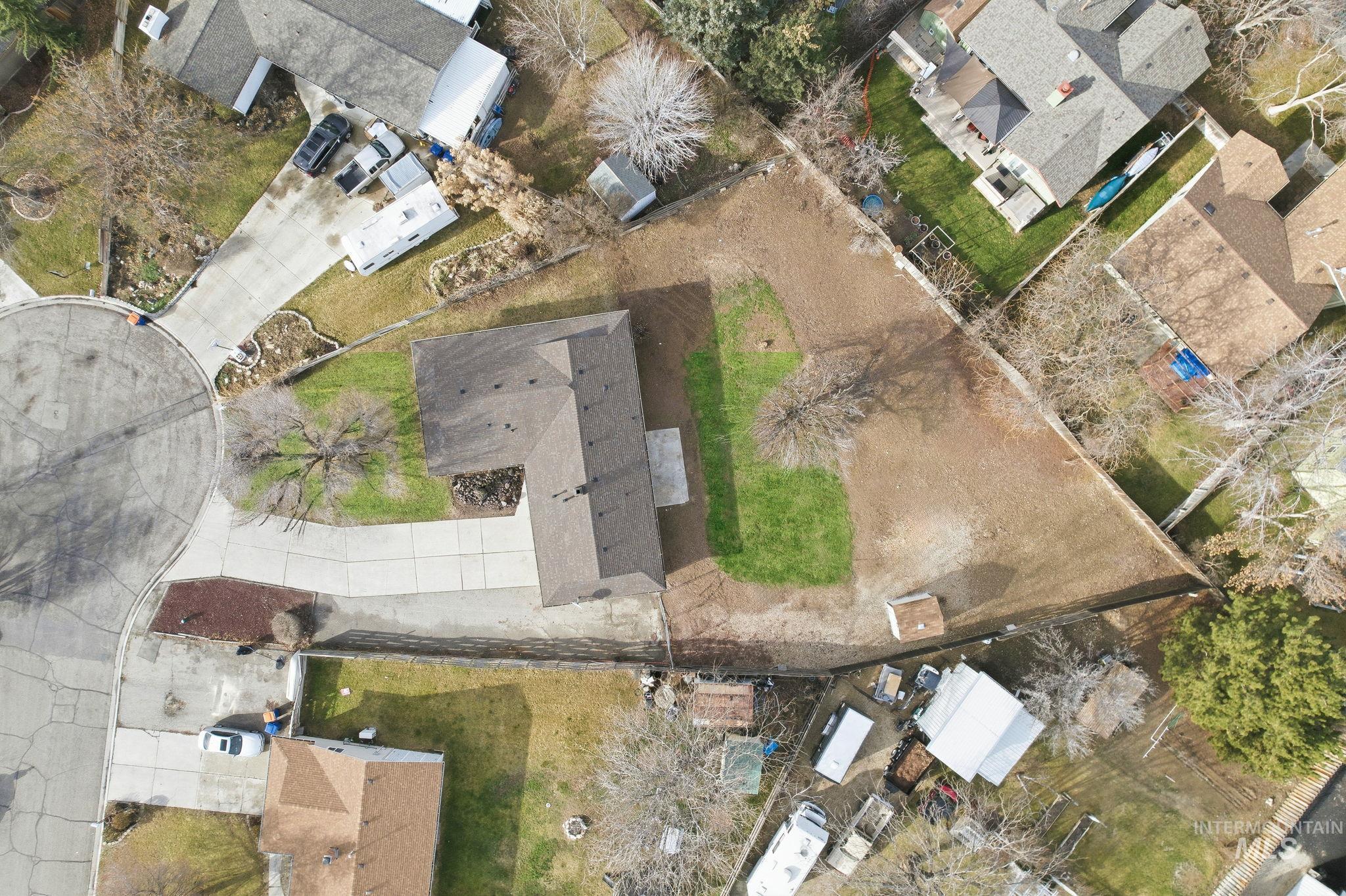 Aerial view of property's location featuring nearby suburban area