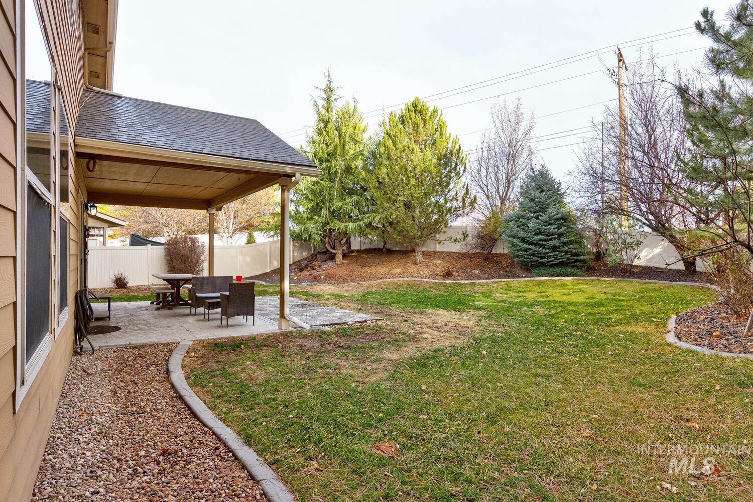 Fenced backyard featuring a patio area