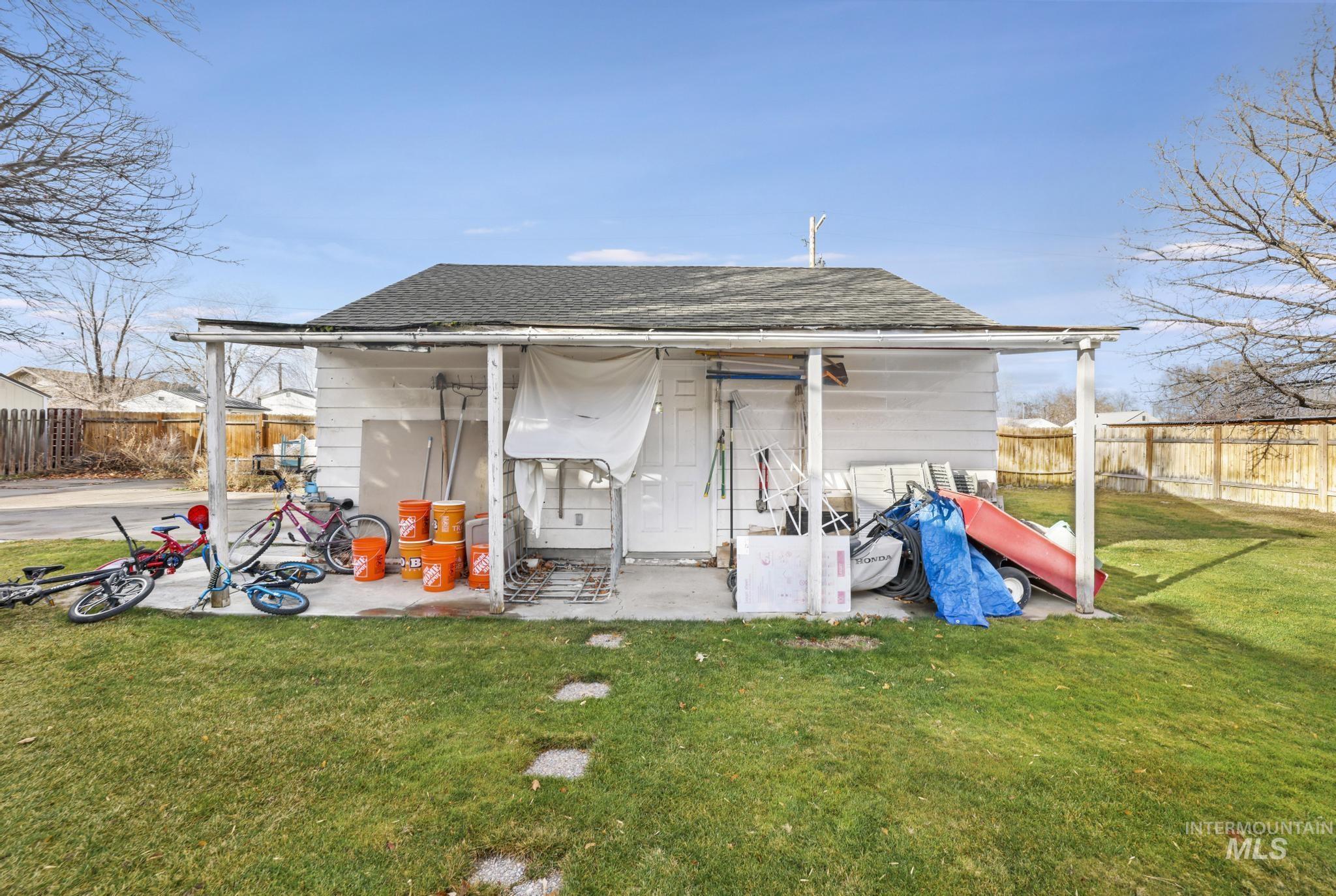 View of outdoor structure featuring a fenced backyard