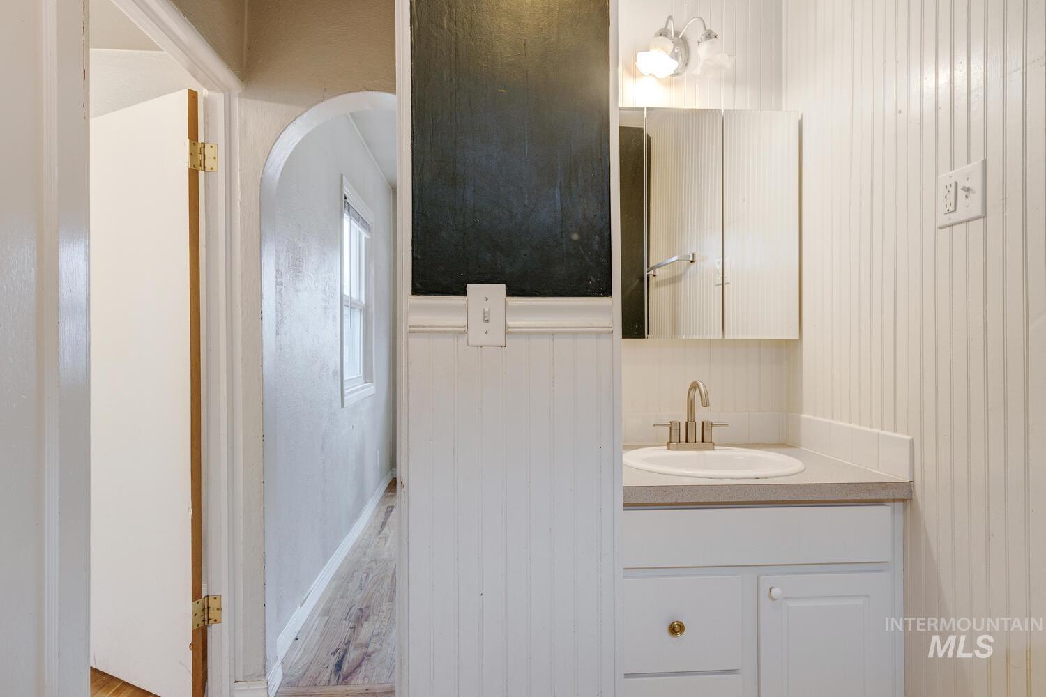 Bathroom with vanity and light wood-style flooring