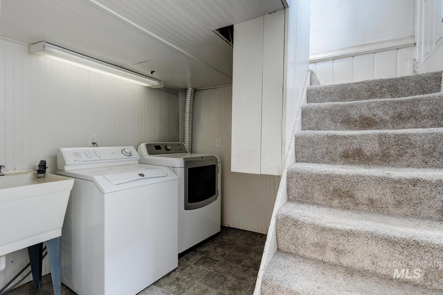 Washroom featuring separate washer and dryer