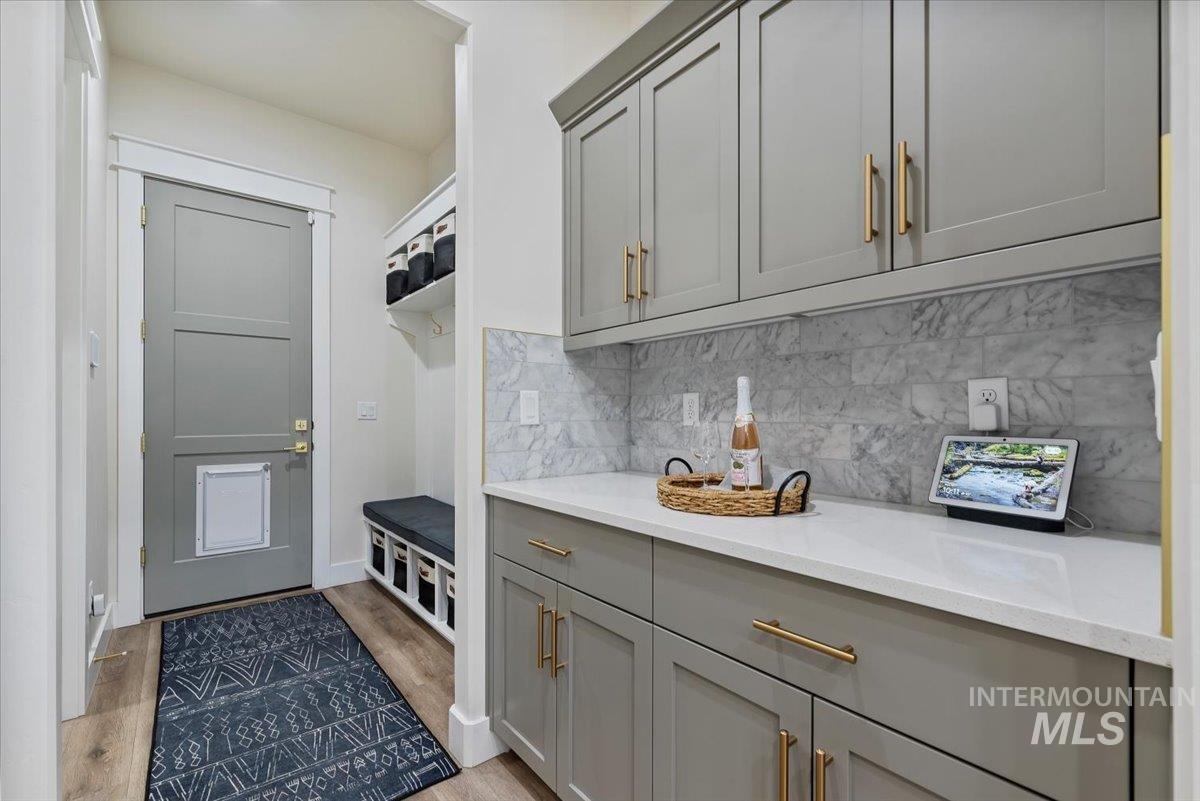 Mudroom featuring light wood-style floors