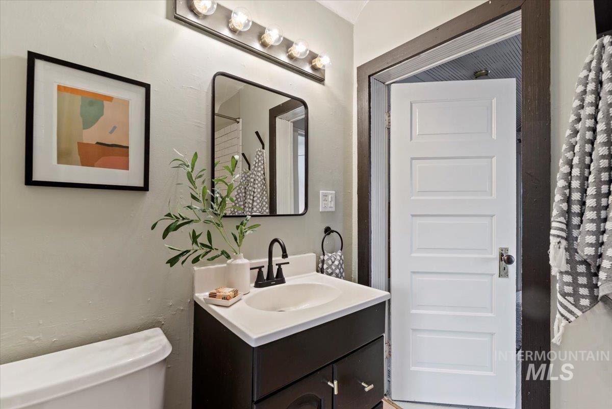 Half bath featuring vanity and toilet