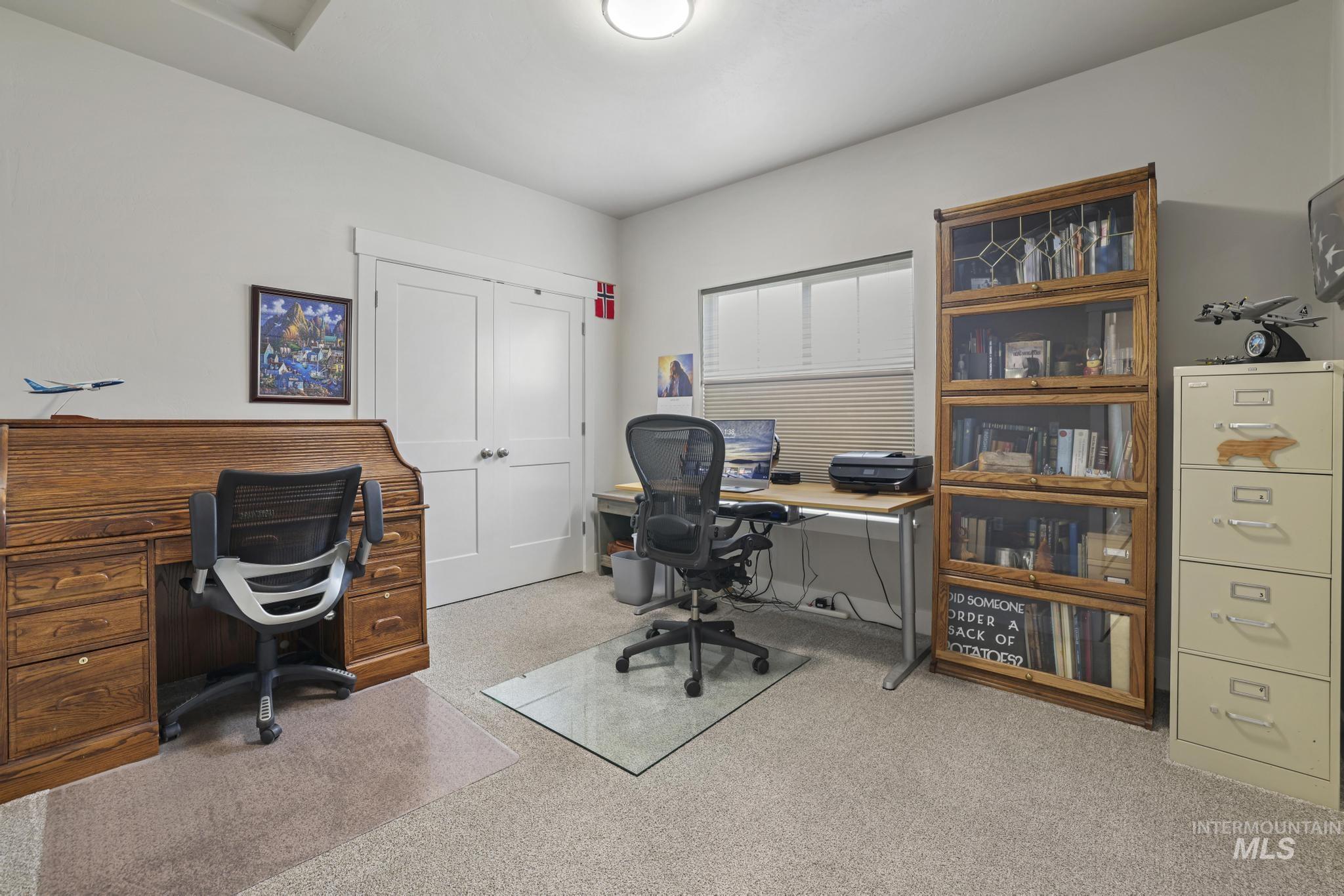 Home office with light carpet