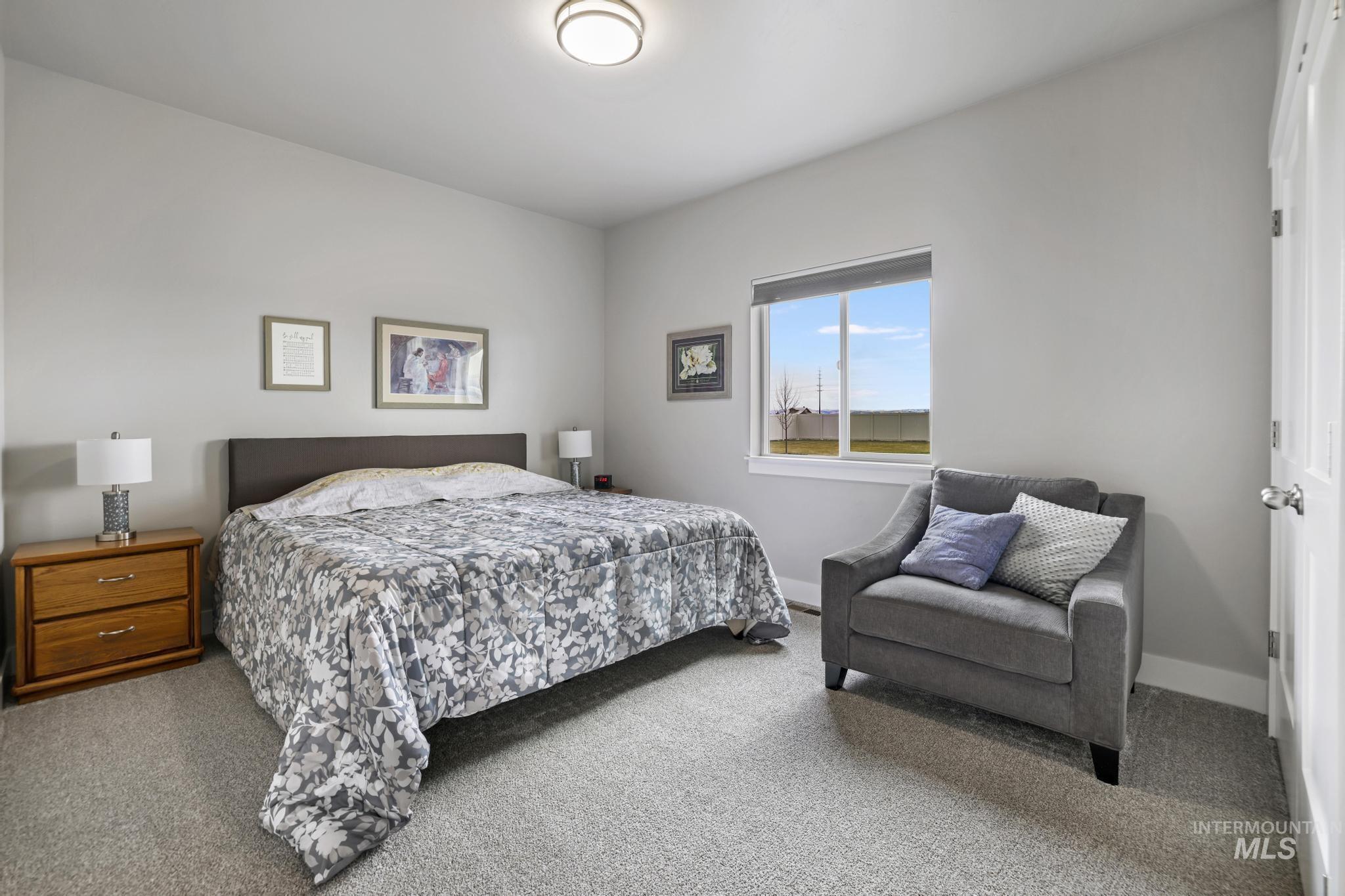 Carpeted bedroom with baseboards