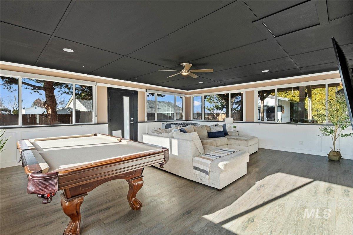 Game room with pool table and a ceiling fan