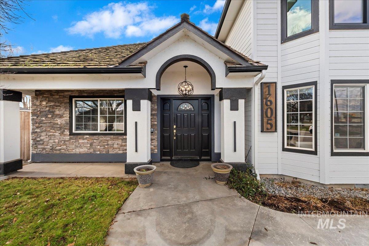 View of exterior entry with stone siding