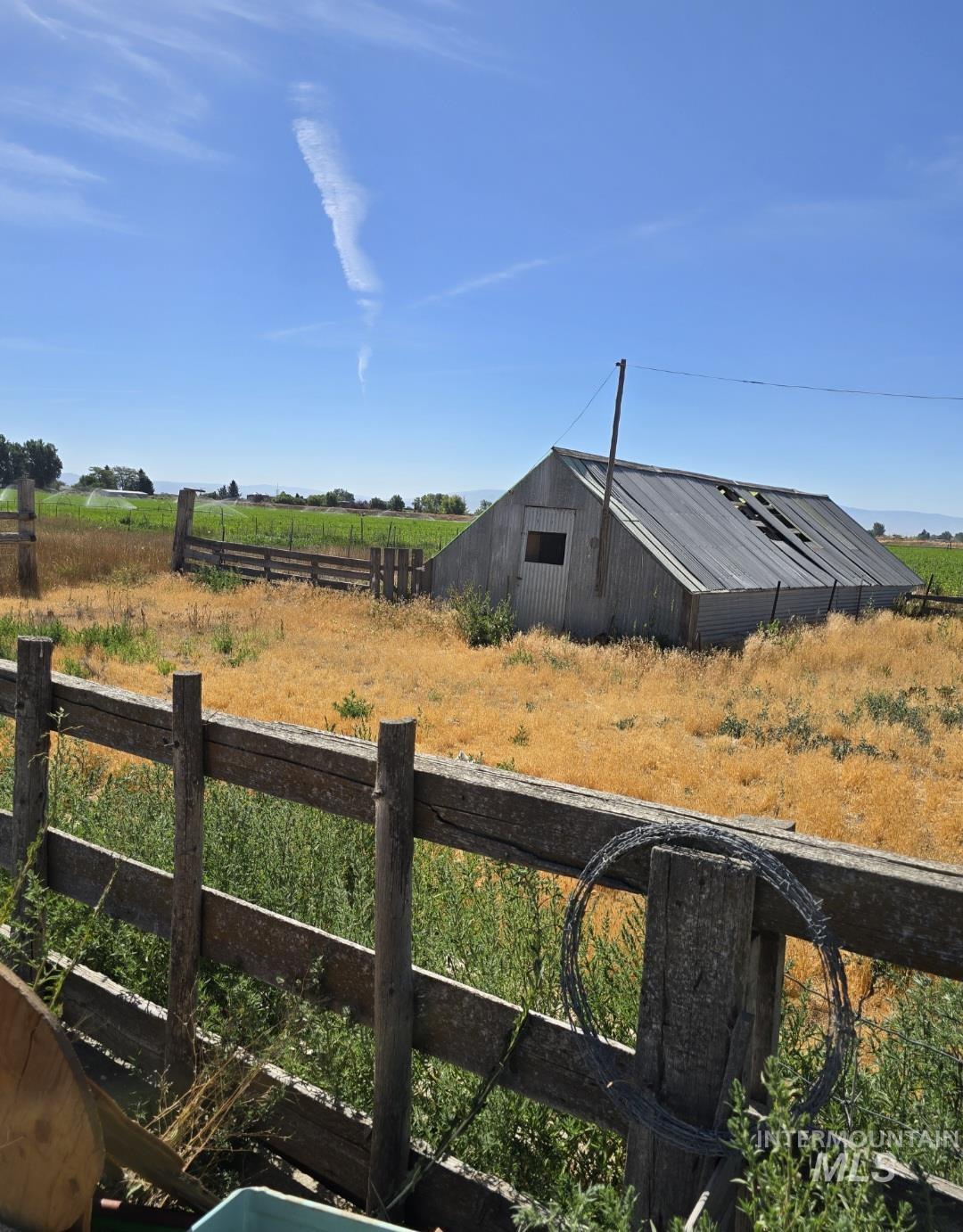 View of yard featuring an outbuilding and a rural view