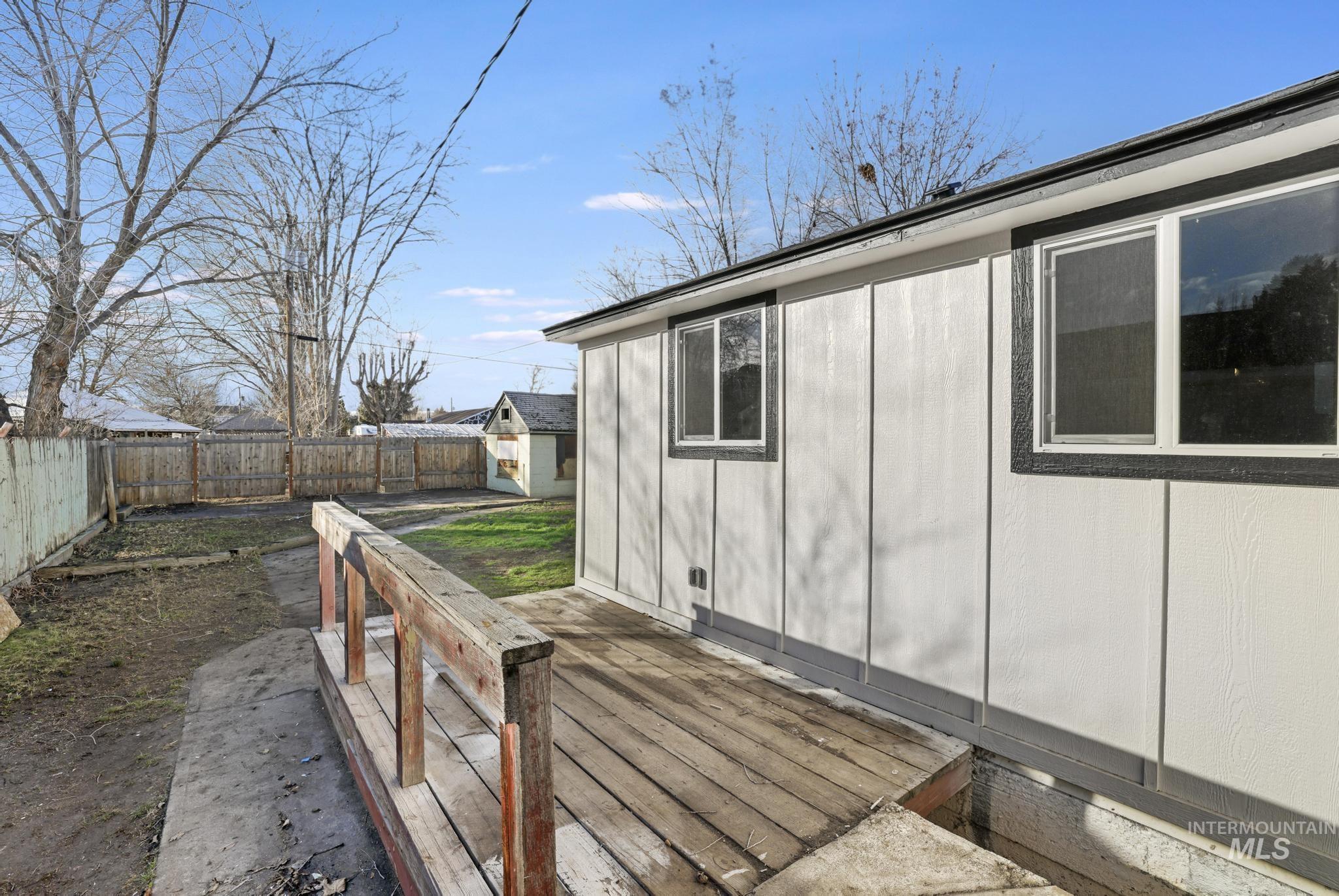 Deck with a fenced backyard