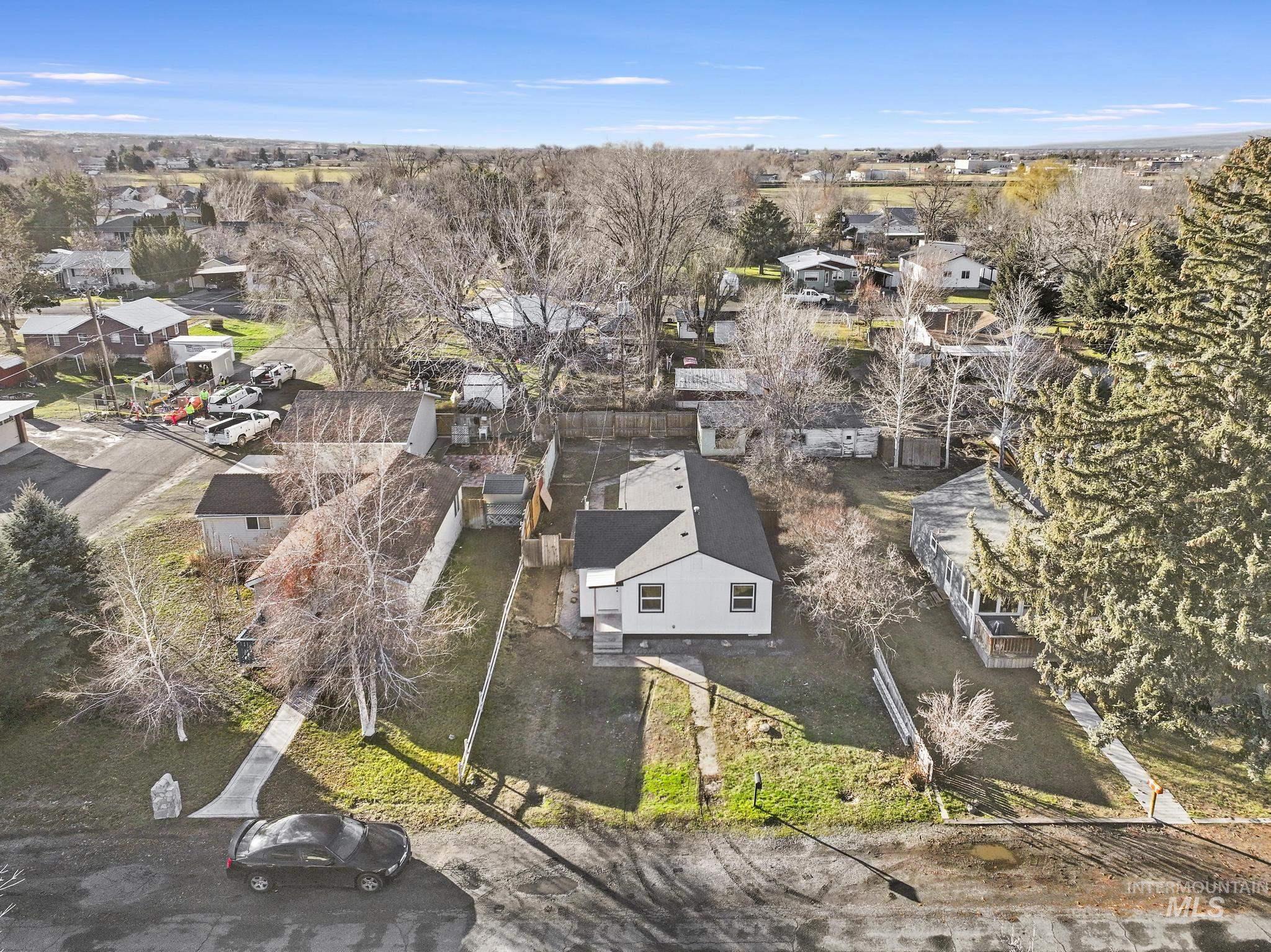 Aerial overview of property's location featuring nearby suburban area