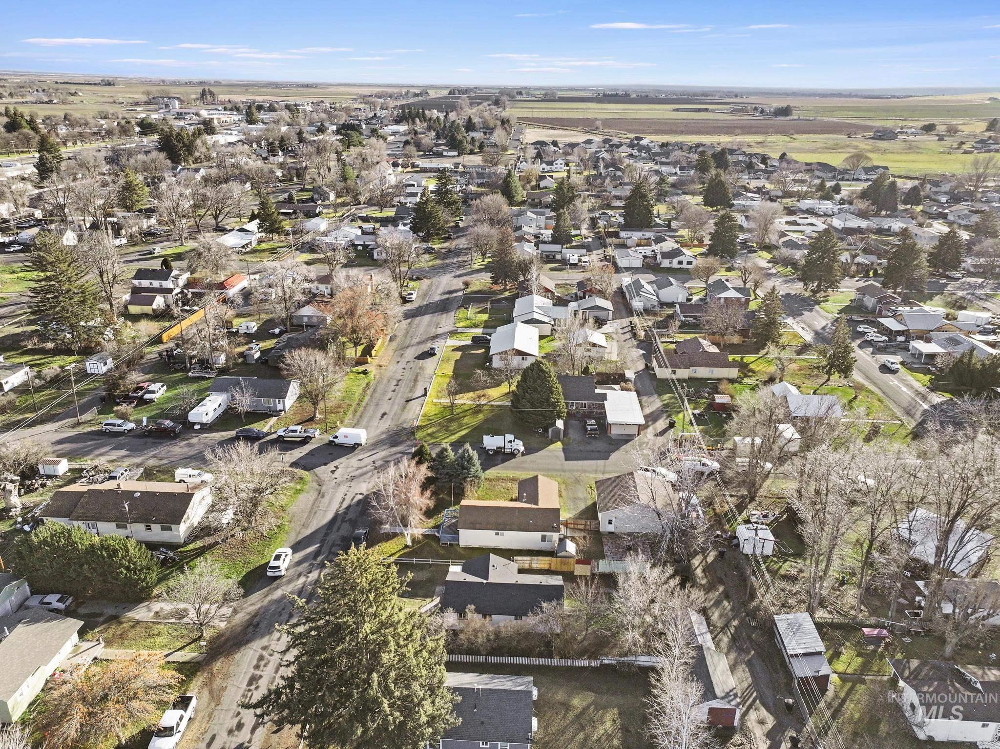 Aerial overview of property's location with nearby suburban area
