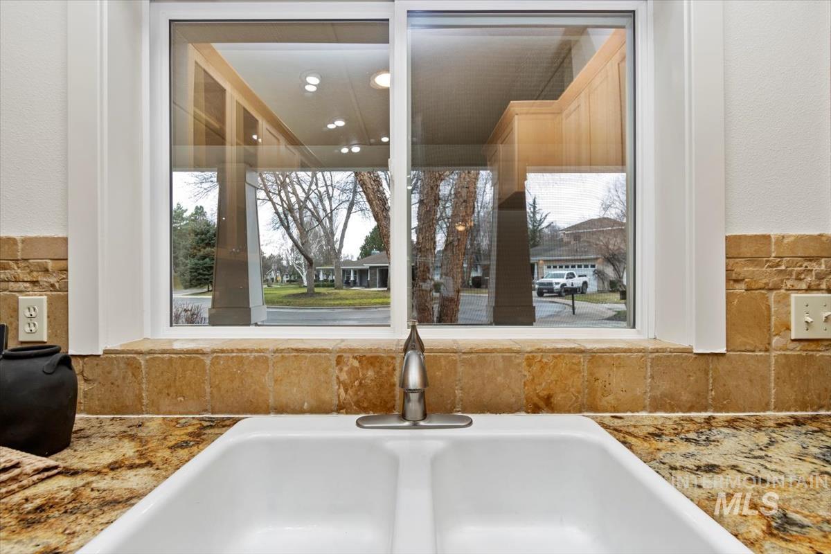 Kitchen view of light stone counters