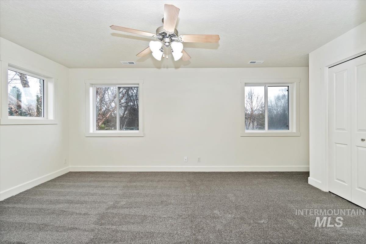 Enormous unfurnished bedroom, ceiling fan, closets. Also would make a great bonus room.