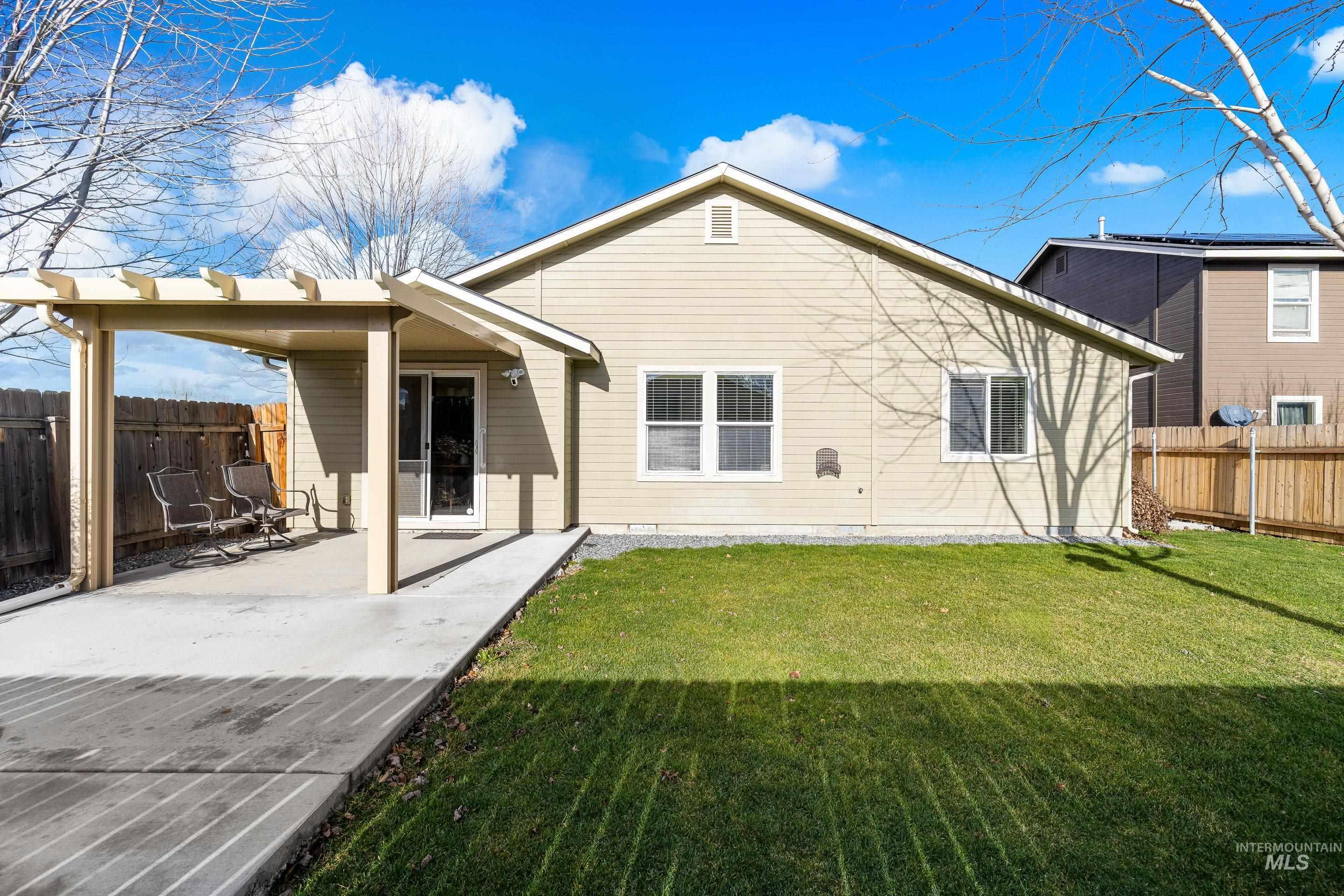 Rear view of property featuring a patio